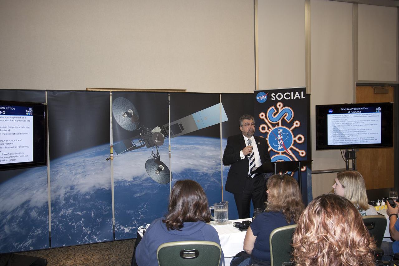 CAPE CANAVERAL, Fla. -- At NASA's Kennedy Space Center in Florida, Badri Younes, NASA deputy associate administrator for Space Communications and Navigation, or SCaN, addresses agency social media followers on the first day of activities of a NASA Social revolving around NASA's Tracking and Data Relay Satellite-K mission. NASA Socials are in-person meetings for people who engage with the agency through Twitter, Facebook, Google+ and other social networks. The satellite, known as TDRS-K, is set to launch at 8:48 p.m. EST on Jan. 30 aboard a United Launch Alliance Atlas V rocket from Space Launch Complex 41 on nearby Cape Canaveral Air Force Station. About 50 followers were selected to participate in the TDRS-K prelaunch and launch activities and share them with their own fan base. The TDRS-K spacecraft is part of the next-generation series in the Tracking and Data Relay Satellite System, a constellation of space-based communication satellites providing tracking, telemetry, command and high-bandwidth data return services. For more information, visit http://www.nasa.gov/mission_pages/tdrs/index.html. Photo credit: NASA/Jim Grossmann