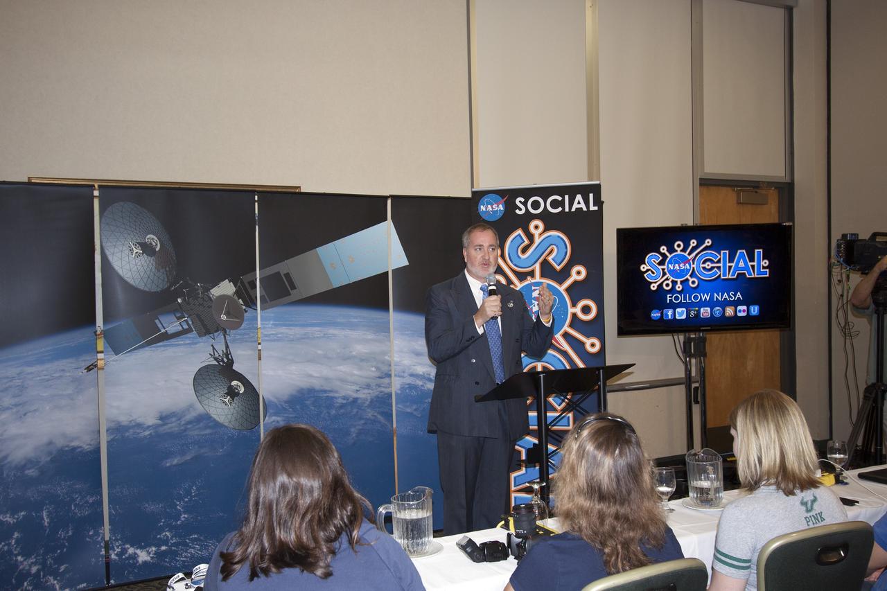 CAPE CANAVERAL, Fla. -- At NASA's Kennedy Space Center in Florida, Michael Woltman, senior vehicle systems engineer for NASA's Launch Services Program, addresses agency social media followers on the first day of activities of a NASA Social revolving around NASA's Tracking and Data Relay Satellite-K mission.    NASA Socials are in-person meetings for people who engage with the agency through Twitter, Facebook, Google+ and other social networks. The satellite, known as TDRS-K, is set to launch at 8:48 p.m. EST on Jan. 30 aboard a United Launch Alliance Atlas V rocket from Space Launch Complex 41 on nearby Cape Canaveral Air Force Station. About 50 followers were selected to participate in the TDRS-K prelaunch and launch activities and share them with their own fan base.  The TDRS-K spacecraft is part of the next-generation series in the Tracking and Data Relay Satellite System, a constellation of space-based communication satellites providing tracking, telemetry, command and high-bandwidth data return services. For more information, visit http://www.nasa.gov/mission_pages/tdrs/index.html.  Photo credit: NASA/Jim Grossmann