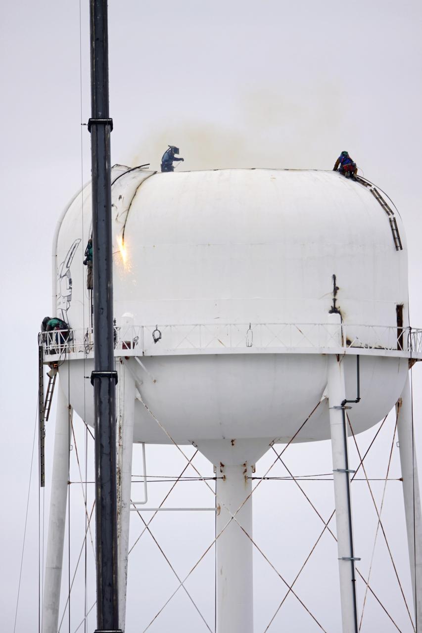 CAPE CANAVERAL, Fla. – Workers use a cutting torch to dismantle a water tower in the Launch Complex 39 area at NASA’s Kennedy Space Center in Florida. The effort is part of on-going efforts to upgrade and revitalize Kennedy's water and sewer systems to increase their reliability, sustainability and capabilities into the 21st century for current and future users. For more information, visit: http://kscpartnerships.ksc.nasa.gov/masterPlan/spaceportConcept.htm Photo credit: NASA/Tim Jacobs
