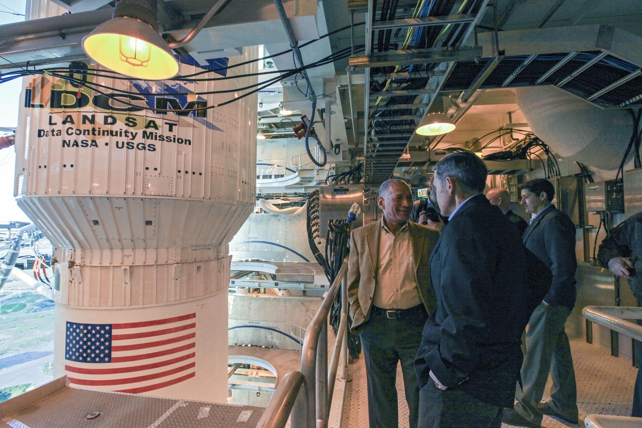 VANDENBERG AFB, Calif. -- At Space Launch Complex 3E at Vandenberg Air Force Base, Calif., NASA Administrator Charles Bolden, left, discusses Landsat Data Continuity Mission, or LDCM, satellite preparations with Kennedy Space Center Director Bob Cabana.      The Landsat Data Continuity Mission LDCM is the future of Landsat satellites. It will continue to obtain valuable data and imagery to be used in agriculture, education, business, science, and government. The Landsat Program provides repetitive acquisition of high resolution multispectral data of the Earth's surface on a global basis. The data from the Landsat spacecraft constitute the longest record of the Earth's continental surfaces as seen from space. It is a record unmatched in quality, detail, coverage, and value. Liftoff is planned for Feb. 11, 2013 aboard a United Launch Alliance Atlas V rocket. For more information, visit: http://www.nasa.gov/mission_pages/landsat/main/index.html Photo credit: NASA/Kim Shiflett
