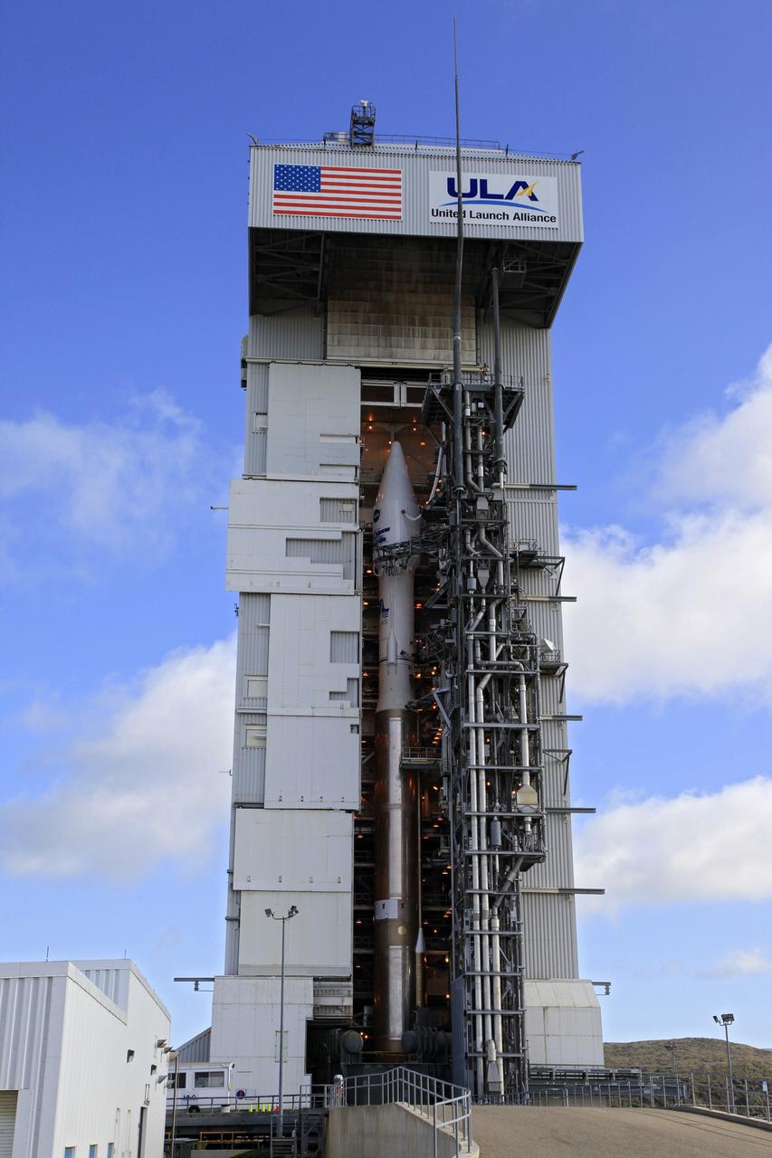 VANDENBERG AFB, Calif. -- At Vandenberg Air Force Base, Calif., NASA's Landsat Data Continuity Mission, or LDCM, satellite is mounted atop a United Launch Alliance Atlas V rocket in the gantry at Space Launch Complex 3E.      The Landsat Data Continuity Mission LDCM is the future of Landsat satellites. It will continue to obtain valuable data and imagery to be used in agriculture, education, business, science, and government. The Landsat Program provides repetitive acquisition of high resolution multispectral data of the Earth's surface on a global basis. The data from the Landsat spacecraft constitute the longest record of the Earth's continental surfaces as seen from space. It is a record unmatched in quality, detail, coverage, and value. Liftoff is planned for Feb. 11, 2013 aboard a United Launch Alliance Atlas V rocket. For more information, visit: http://www.nasa.gov/mission_pages/landsat/main/index.html Photo credit: NASA/Kim Shiflett