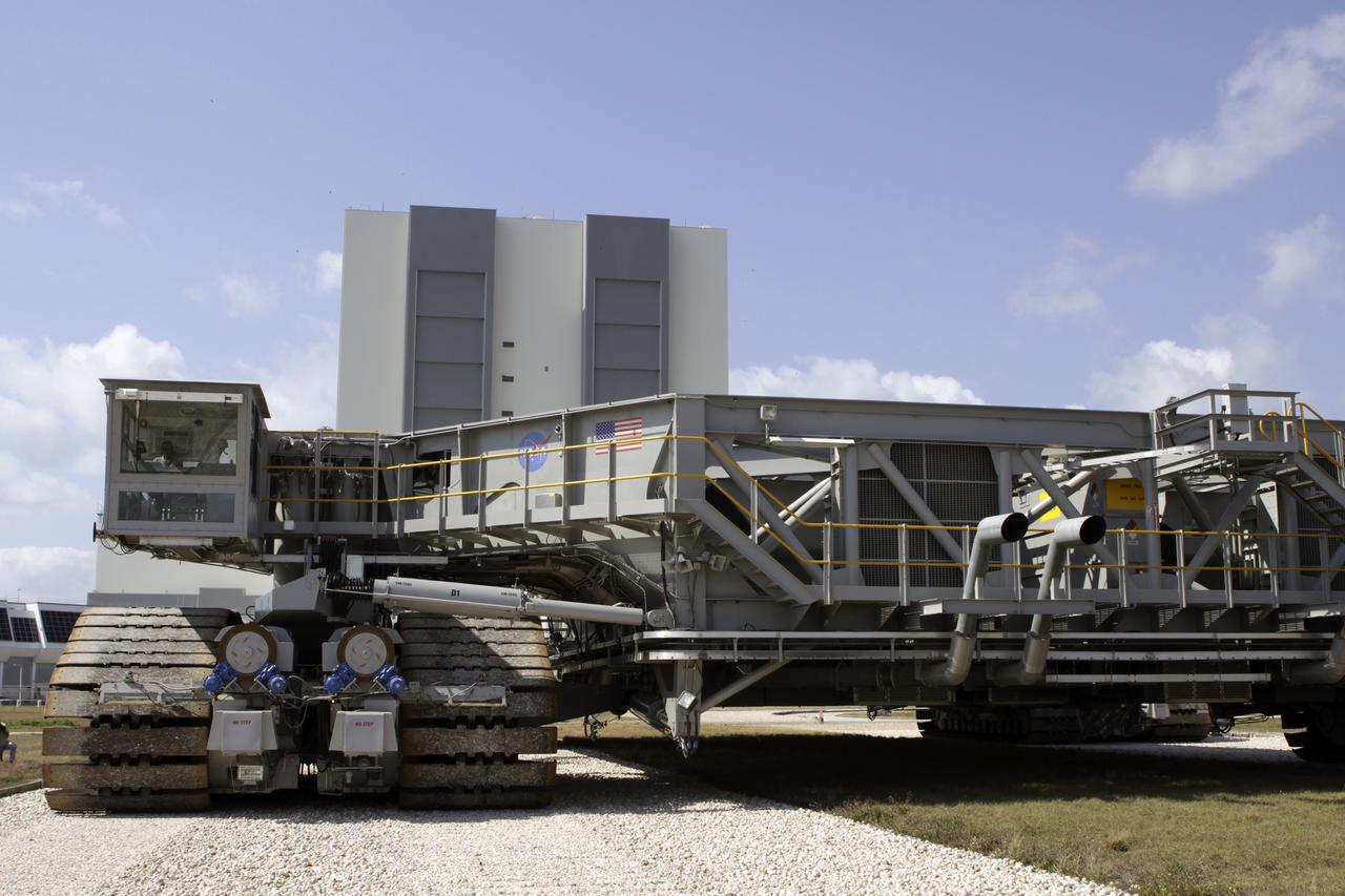 CAPE CANAVERAL, Fla. – At NASA’s Kennedy Space Center in Florida, the crawler-transporter 2, or CT-2, is on its way from the Vehicle Assembly Building to the Park Site west of the building. The transporter has new brakes and mufflers and a recently-painted white roof deck. The Ground Systems Development and Operations Program office at Kennedy is overseeing the upgrades to CT-2 so that it can carry NASA’s Space Launch System heavy-lift rocket, which is under design, and new Orion spacecraft to the launch pad. The crawler-transporters were used to carry the mobile launcher platform and space shuttle to Launch Complex 39 for space shuttle launches for 30 years. Photo credit: NASA/Jim Grossmann