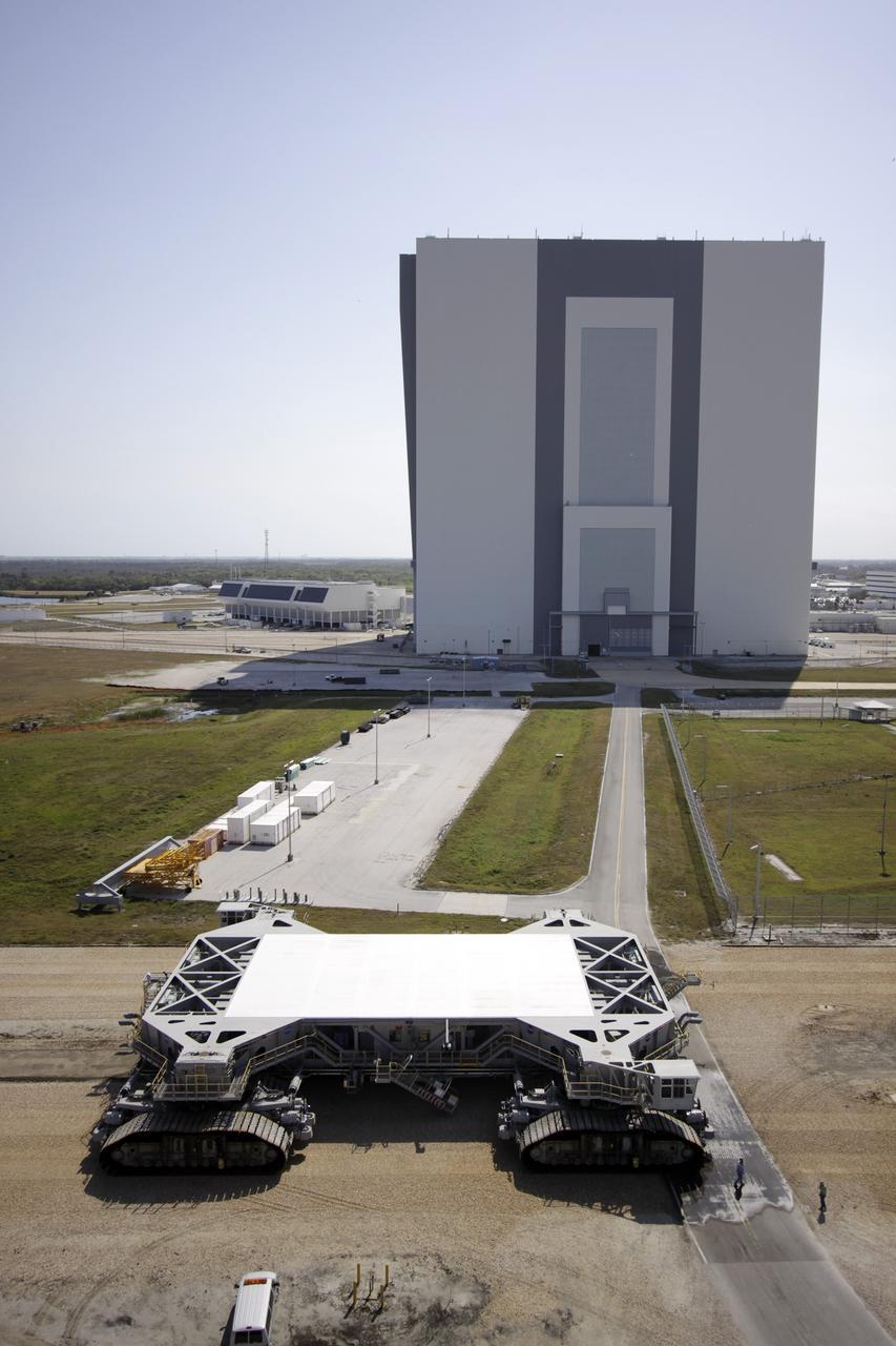 CAPE CANAVERAL, Fla. – At NASA’s Kennedy Space Center in Florida, the crawler-transporter 2, or CT-2, is on its way to the Park Site west of the Vehicle Assembly Building. The transporter has new brakes and mufflers and a recently-painted white roof deck. The Ground Systems Development and Operations Program office at Kennedy is overseeing the upgrades to CT-2 so that it can carry NASA’s Space Launch System heavy-lift rocket, which is under design, and new Orion spacecraft to the launch pad. The crawler-transporters were used to carry the mobile launcher platform and space shuttle to Launch Complex 39 for space shuttle launches for 30 years. Photo credit: NASA/Jim Grossmann