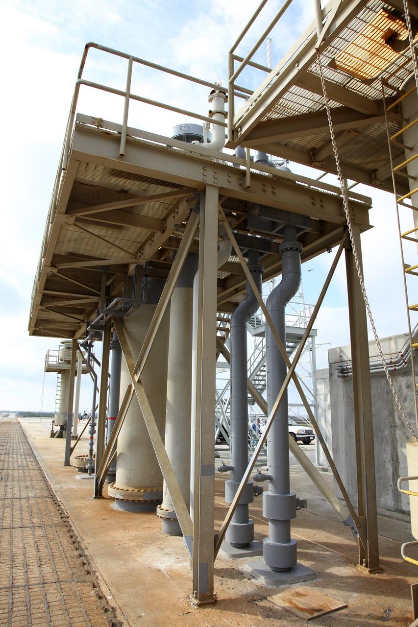 CAPE CANAVERAL, Fla. -- At NASA’s Kennedy Space Center in Florida, various fluid interface connections have been installed at Launch Pad 39B. New system connections include chilled water supply-and-return and conditioned air that will be used to provide the mobile launcher with the necessary commodities during launch operations.    The Ground Systems Development and Operations Program office at Kennedy is overseeing upgrades and modifications to Pad B to support the launch of NASA’s Space Launch System heavy-lift rocket, which is under design, and new Orion spacecraft. The pads supported space shuttle launches for 30 years.  Photo credit: NASA/Frankie Martin