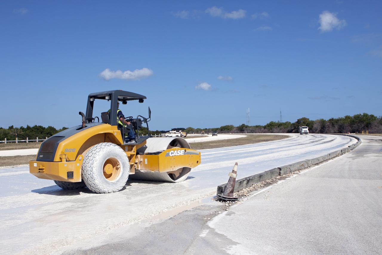 CAPE CANAVERAL, Fla. – A worker from Canaveral Construction in Mims, Fla., re-grades a section of the lime rock on the crawlerway near Launch Pad 39B at NASA’s Kennedy Space Center in Florida.    The crawlerway is being upgraded to improve the foundation and prepare it to support the weight of NASA’s Space Launch System, or SLS, and mobile launcher on the crawler-transporter during rollout. Workers are removing the original Alabama river rock and restoring the layer of lime rock below to its original depth. Then new river rock will be added on top. The Ground Systems Development and Operations, or GSDO, Program office at Kennedy is leading the center’s transformation to safely handle a variety of rockets and spacecraft. For more information about GSDO, visit: http://go.nasa.gov/groundsystems. Photo credit: NASA/Jim Grossmann