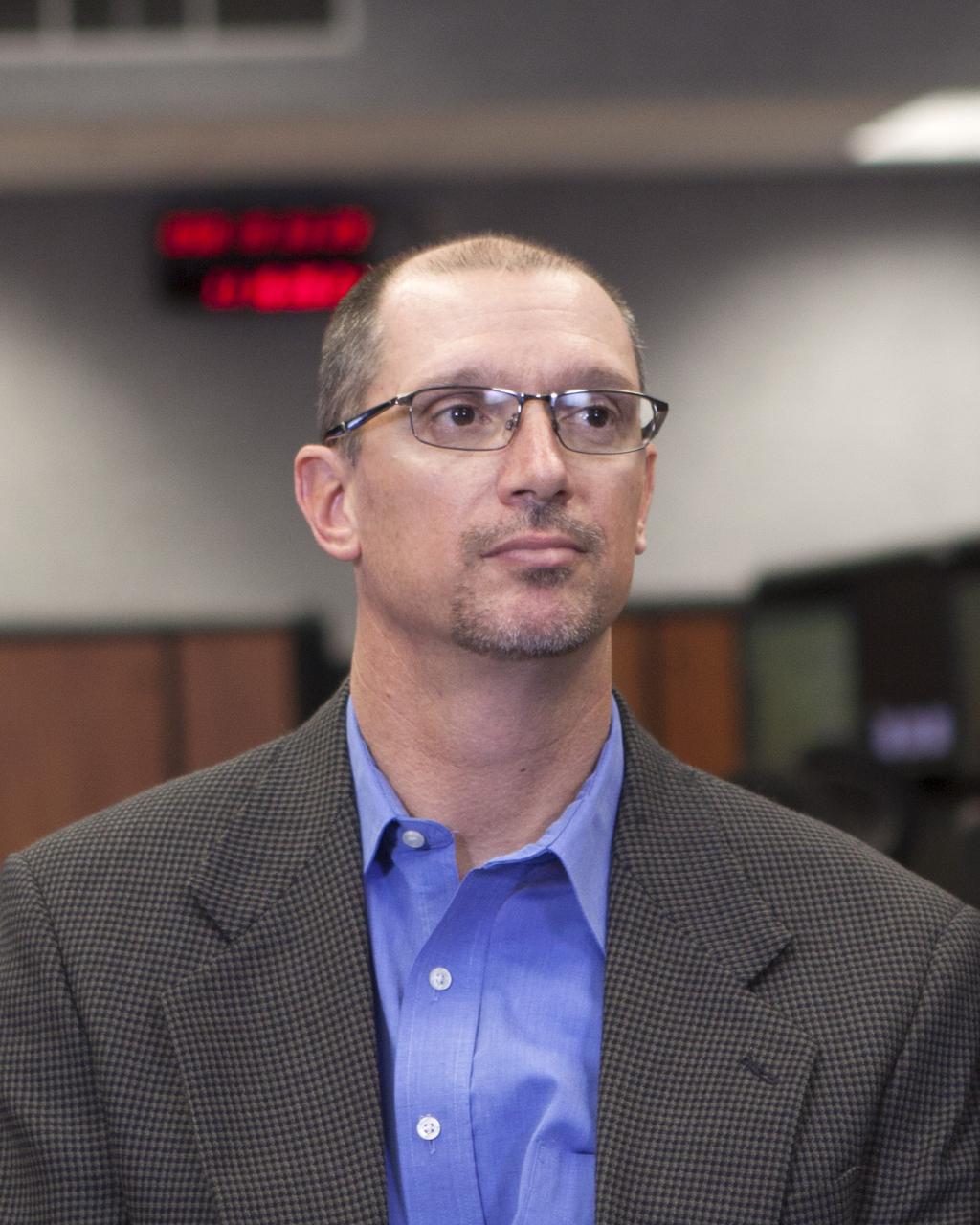 CAPE CANAVERAL, Fla. – Pepper Phillips, Ground Systems Development and Operations program manager, takes part in a briefing inside the Young-Crippen Firing Room at NASA's Kennedy Space Center in Florida. NASA officials discussed the goals and expectations for a September 2014 flight test called Exploration Flight Test-1 or EFT-1 as part of the agency's goal of launching astronauts into deep space. Photo credit: NASA/Jim Grossmann