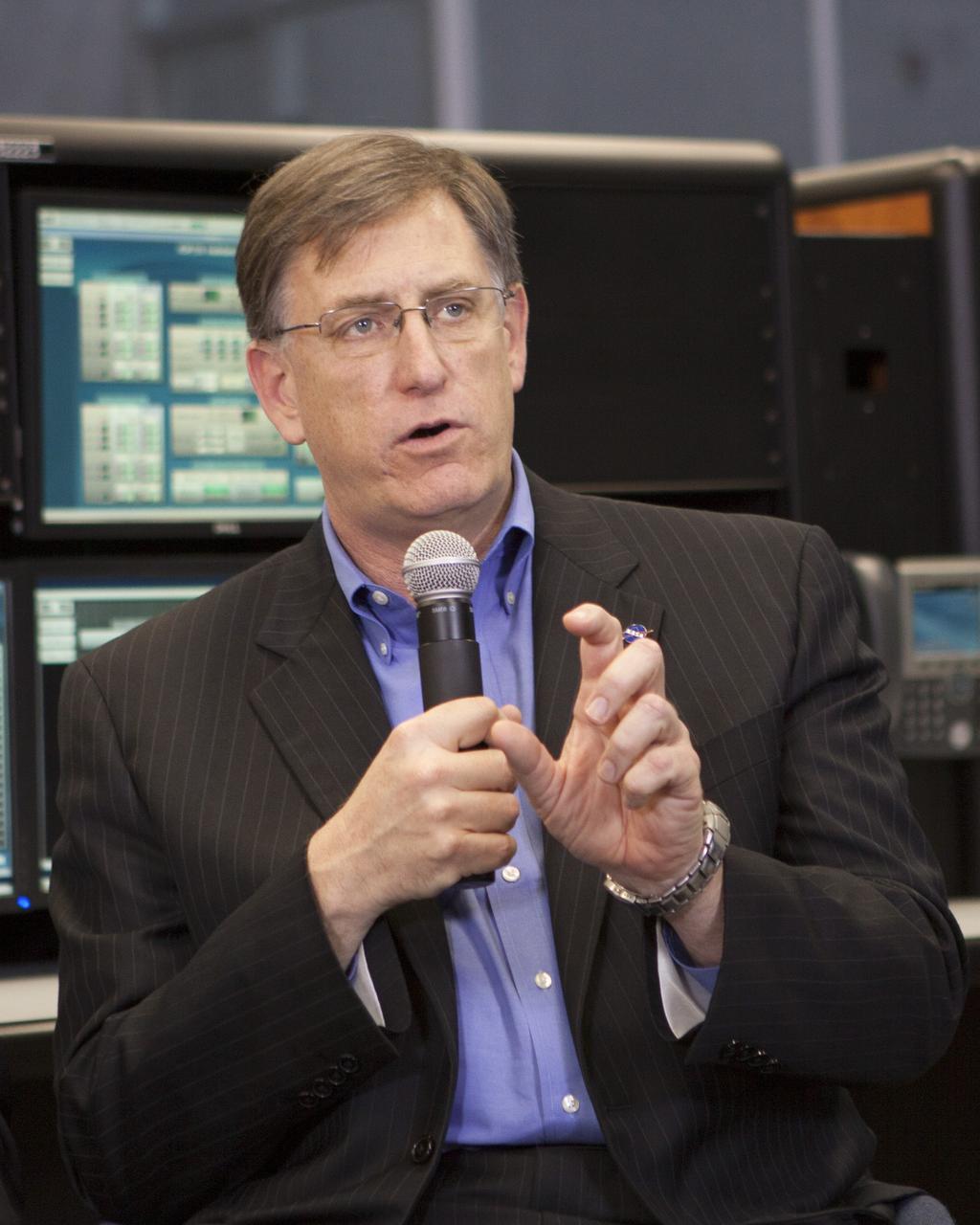 CAPE CANAVERAL, Fla. – Dan Dumbacher, deputy associate administrator for the Exploration Systems Development Division, takes part in a briefing inside the Young-Crippen Firing Room at NASA's Kennedy Space Center in Florida. NASA officials discussed the goals and expectations for a September 2014 flight test called Exploration Flight Test-1 or EFT-1 as part of the agency's goal of launching astronauts into deep space. Photo credit: NASA/Jim Grossmann
