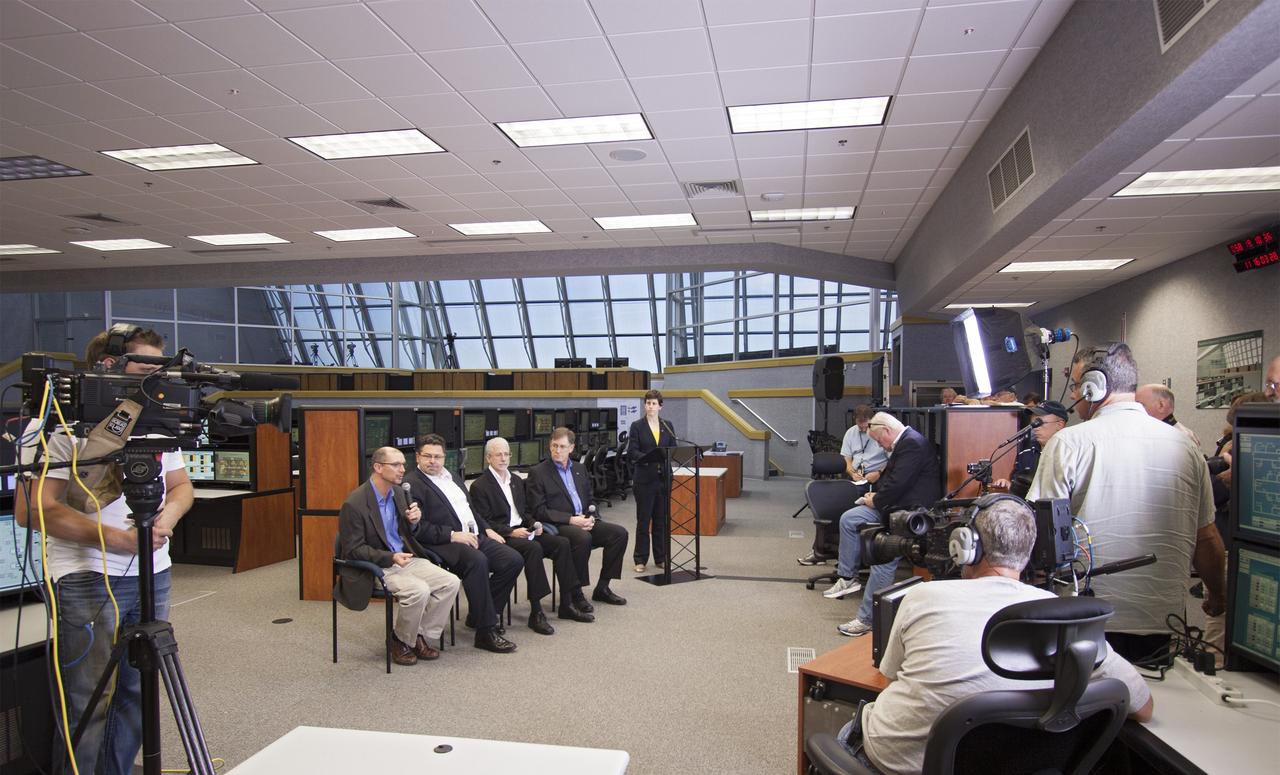 CAPE CANAVERAL, Fla. – NASA officials detail progress toward a September 2014 flight test called Exploration Flight Test-1 or EFT-1 as part of the agency's goal of launching astronauts into deep space. Speaking inside the Young-Crippen Firing Room at NASA's Kennedy Space Center in Florida, the officials discussed the goals and expectations for EFT-1 with news media. Seated, facing the camera from left to right are Pepper Phillips, Ground Systems Development and Operations program manager, Todd May, Space Launch System program manager, Mark Geyer, Orion program manager and Dan Dumbacher, deputy associate administrator for the Exploration Systems Development Division. Standing is Rachel Kraft, a public affairs officer from NASA Headquarters in Washington D.C. Photo credit: NASA/Jim Grossmann