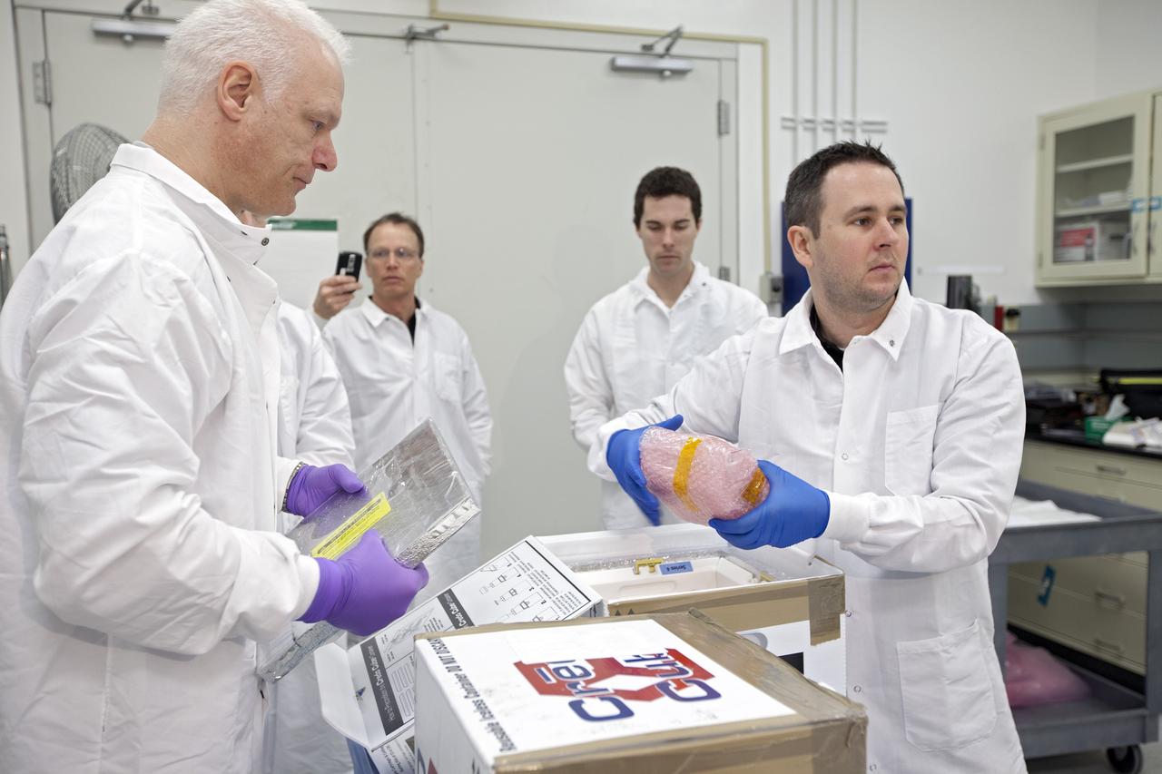CAPE CANAVERAL, Fla. - In the Space Station Processing Facility at NASA's Kennedy Space Center in Florida, engineers prepare experiments for loading aboard the SpaceX Dragon capsule for launch to the International Space Station. Once the packaging is complete, the samples will be transported to Space Launch Complex-40 on Cape Canaveral Air Force Station where they will be loaded aboard the Dragon.    Scheduled for launch March 1 atop a Falcon 9 rocket, Dragon will be making its third trip to the space station. The mission is the second of 12 SpaceX flights contracted by NASA to resupply the orbiting laboratory. For more information, visit http://www.nasa.gov/mission_pages/station/structure/launch/spacex2-feature.html Photo credit: NASA/Kim Shiflett