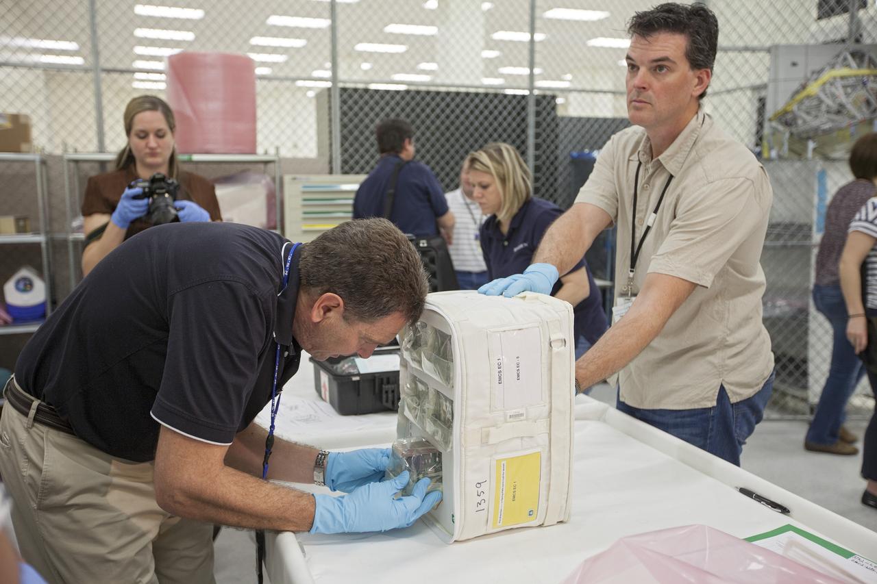 CAPE CANAVERAL, Fla. - In the Space Station Processing Facility at NASA's Kennedy Space Center in Florida, engineers prepare experiments for loading aboard the SpaceX Dragon capsule for launch to the International Space Station. Once the packaging is complete, the samples will be transported to Space Launch Complex-40 on Cape Canaveral Air Force Station where they will be loaded aboard the Dragon.    Scheduled for launch March 1 atop a Falcon 9 rocket, Dragon will be making its third trip to the space station. The mission is the second of 12 SpaceX flights contracted by NASA to resupply the orbiting laboratory. For more information, visit http://www.nasa.gov/mission_pages/station/structure/launch/spacex2-feature.html Photo credit: NASA/Kim Shiflett