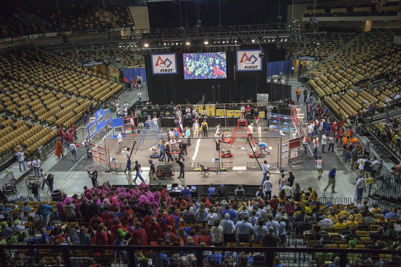 ORLANDO, Fla. – Teams of high school students prepare robots for competition in the University of Central Florida Arena as part of the FIRST Robotics Competition's 2013 Orlando Regional. The student-built robots were required to throw discs into boxes or make climbs to score points. Photo credit: NASA/Frankie Martin