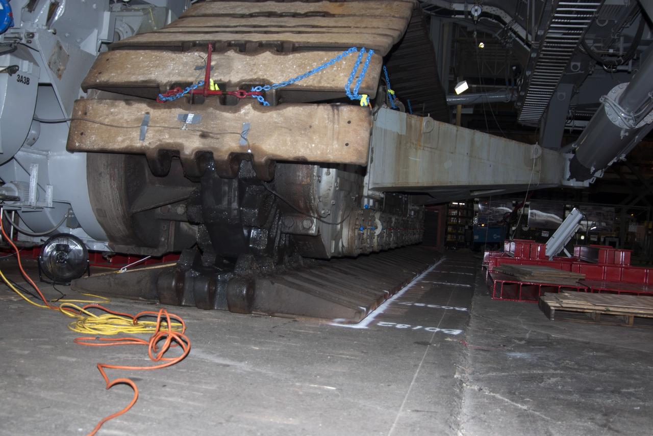 CAPE CANAVERAL, Fla. -- Technicians in the Vehicle Assembly Building at NASA’s Kennedy Space Center in Florida, are preparing to jack crawler-transporter 2, or CT-2, four feet off the floor to facilitate removal of the roller bearing assemblies. After inspections, new assemblies will be installed.    The Ground Systems Development and Operations Program office at Kennedy is overseeing the upgrades to CT-2 so that it can carry NASA’s Space Launch System heavy-lift rocket and new Orion spacecraft to the launch pad. For more than 45 years the crawler-transporters were used to transport the mobile launcher platform and the Apollo-Saturn V rockets and, later, space shuttles to Launch Pads 39A and B. Photo credit: NASA/Charisse Nahser