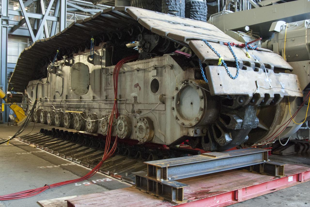 CAPE CANAVERAL, Fla. -- Technicians in the Vehicle Assembly Building at NASA’s Kennedy Space Center in Florida, are jacking crawler-transporter 2, or CT-2, four feet off the floor to facilitate removal of the roller bearing assemblies. After inspections, new assemblies will be installed.      The Ground Systems Development and Operations Program office at Kennedy is overseeing the upgrades to CT-2 so that it can carry NASA’s Space Launch System heavy-lift rocket and new Orion spacecraft to the launch pad. For more than 45 years the crawler-transporters were used to transport the mobile launcher platform and the Apollo-Saturn V rockets and, later, space shuttles to Launch Pads 39A and B. Photo credit: NASA/Charisse Nahser
