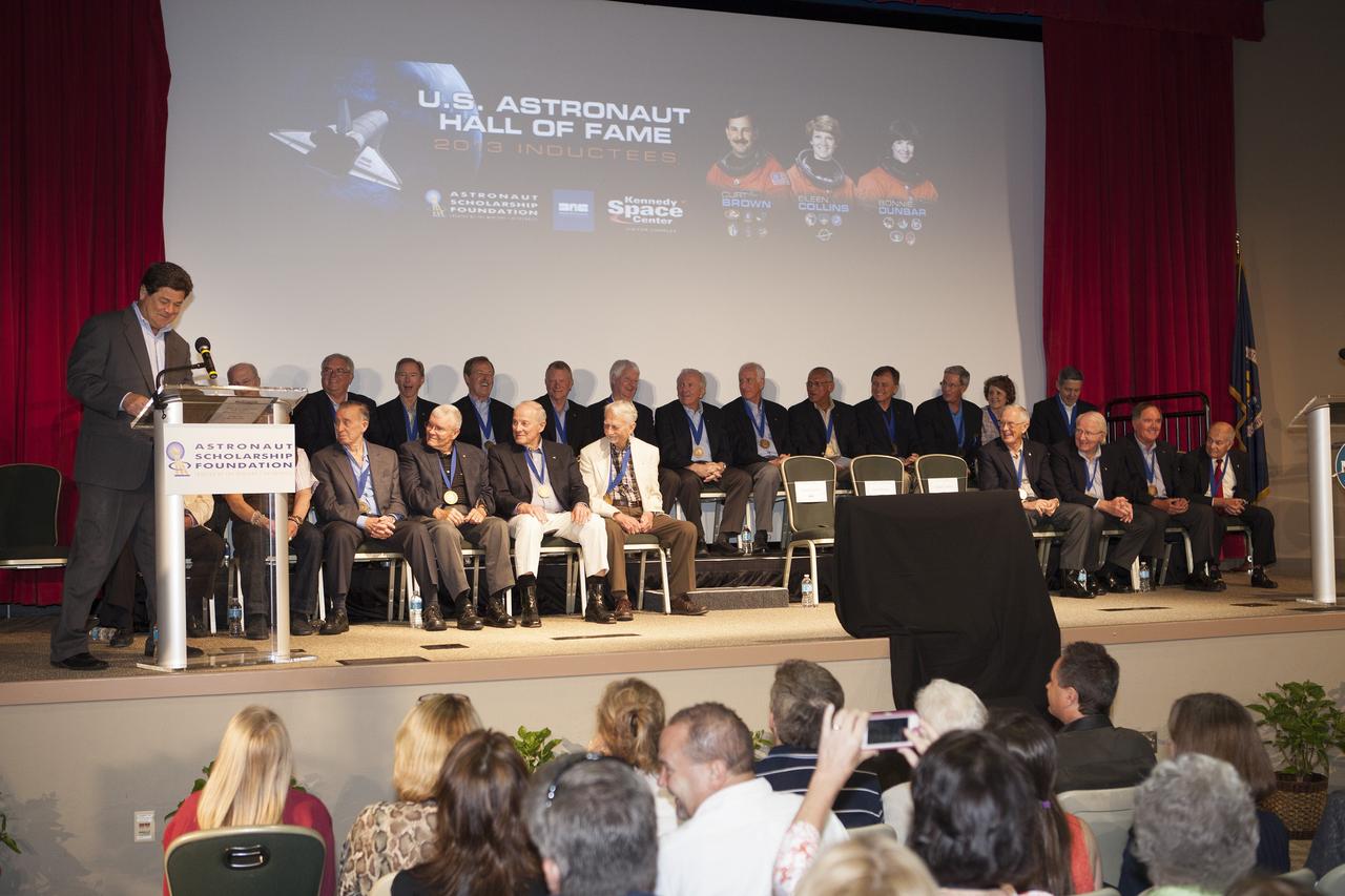 CAPE CANAVERAL, Fla. – At NASA’s Kennedy Space Center Visitor Complex in Florida, Master of Ceremonies John Zarrella, CNN's principal correspondent for coverage of NASA’s space programs, addresses the inductees and visitors with opening remarks. Hall of Fame astronauts and visitors gathered to honor 2013 inductees Curt Brown, Eileen Collins and Bonnie Dunbar.      This induction is the twelfth group of space shuttle astronauts named to the AHOF, and the first time two women are inducted at the same time. The year’s inductees were selected by a committee of current Hall of Fame astronauts, former NASA officials, historians and journalists. The selection process is administered by the Astronaut Scholarship Foundation. For more on the U.S. Astronaut Hall of Fame, go to http://www.kennedyspacecenter.com/astronaut-hall-of-fame.aspx For more on the Astronaut Scholarship Foundation, go to http://astronautscholarship.org/ Photo credit: NASA/ Kim Shiflett