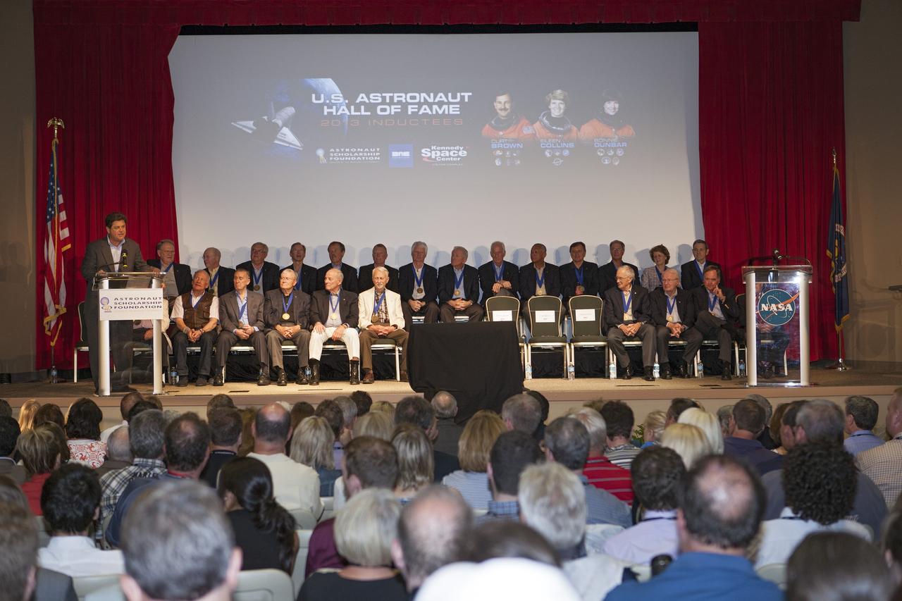 CAPE CANAVERAL, Fla. – At NASA’s Kennedy Space Center Visitor Complex in Florida, Master of Ceremonies John Zarrella, CNN's principal correspondent for coverage of NASA’s space programs, addresses the inductees and visitors with opening remarks. Hall of Fame astronauts and visitors gathered to honor 2013 inductees Curt Brown, Eileen Collins and Bonnie Dunbar.      This induction is the twelfth group of space shuttle astronauts named to the AHOF, and the first time two women are inducted at the same time. The year’s inductees were selected by a committee of current Hall of Fame astronauts, former NASA officials, historians and journalists. The selection process is administered by the Astronaut Scholarship Foundation. For more on the U.S. Astronaut Hall of Fame, go to http://www.kennedyspacecenter.com/astronaut-hall-of-fame.aspx For more on the Astronaut Scholarship Foundation, go to http://astronautscholarship.org/ Photo credit: NASA/ Kim Shiflett