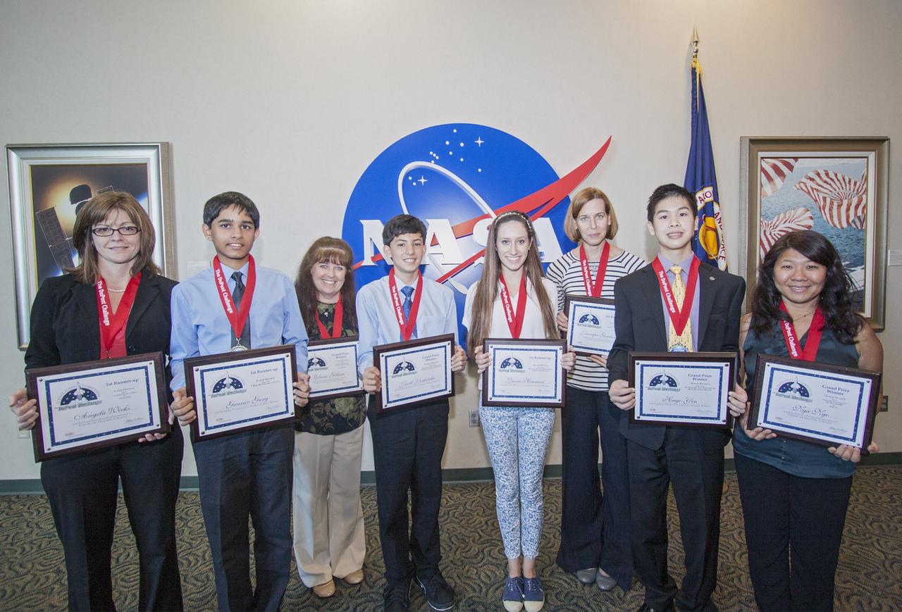 CAPE CANAVERAL, Fla. - The winning students and their teachers of the 2013 DuPont Challenge Science Essay Competition show off their awards after a ceremony at the Kennedy Space Center Visitor Complex in Florida. From left are sponsoring teacher Angela Weeks and Junior Division first runner-up Gaurav Garg of Beckendorff Junior High in Katy, Texas sponsoring teacher Elaine Gillum and Senior Division grand prize winner Jacob Yoshitake of Marshall Middle School in San Diego, Calif. Senior Division first runner-up Laura Herman and sponsoring teacher Jennifer Gordinier of Pine Crest School in Fort Lauderdale, Fla. and Senior Division grand prize awardee Hugo Yen and sponsoring teacher Nga Ngo of Troy High in Fullerton, Calif. The challenge, now in its 27th year, reaches out to students from grades seven through 12 from all 50 states and Canada. More than 200,000 students entered the competition. The DuPont Challenge aims to inspire students to excel and achieve in scientific writing and pursue careers in science, technology, engineering and mathematics STEM. The challenge honors space shuttle Challenger's STS-51L crew members who gave their lives while furthering the cause of exploration and discovery. For more information on the challenge, go to http://thechallenge.dupont.com/sponsors/nasa.php.