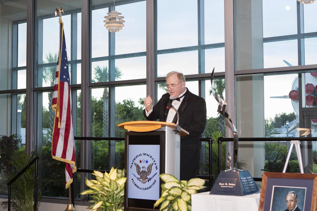 CAPE CANAVERAL, Fla. – At NASA’s Kennedy Space Center Visitor Complex in Florida, National Space Club Florida Committee Chairman Jim McCarthy speaks at the annual the Dr. Kurt H. Debus Award gala in which the prestigious honor was presented to Kennedy's director, Bob Cabana. A former U.S. Marine Corps aviator and NASA astronaut, Cabana was honored at the gala Debus Award Dinner. Named for the spaceport’s first director, the Debus Award was created to recognize significant achievements and contributions made in Florida to American aerospace efforts. The Debus Award was created by the space club's Florida committee to recognize significant achievements and contributions made in Florida to American aerospace efforts. Photo credit: NASA/Jim Grossmann