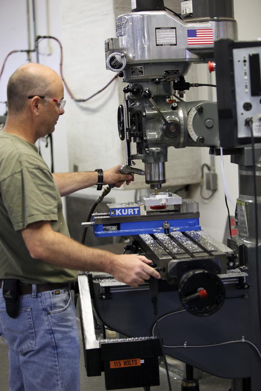 CAPE CANAVERAL, Fla. – A component is machined for a cubesat that is being assembled for launch in June. The component, being machined at NASA's Kennedy Space Center in Florida will hold accelerometers for the StangSat, which is a project whose development includes students from Merritt Island High School in Florida. The satellite will work inside a small rocket to measure vibration and collect other data during launch. NASA engineers are acting as mentors for the project. Photo credit: NASA/Dmitri Gerondidakis