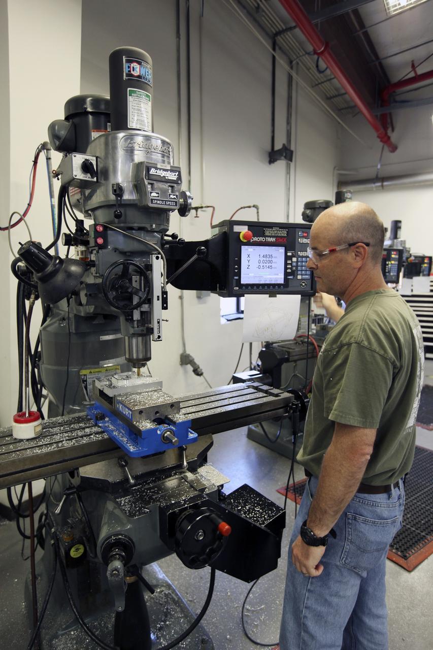 CAPE CANAVERAL, Fla. – A component is machined for a cubesat that is being assembled for launch in June. The component, being machined at NASA's Kennedy Space Center in Florida will hold accelerometers for the StangSat, which is a project whose development includes students from Merritt Island High School in Florida. The satellite will work inside a small rocket to measure vibration and collect other data during launch. NASA engineers are acting as mentors for the project. Photo credit: NASA/Dmitri Gerondidakis