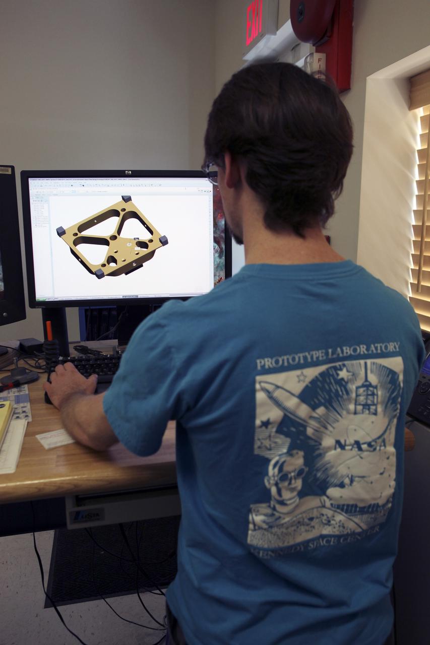 CAPE CANAVERAL, Fla. – A component is machined for a cubesat that is being assembled for launch in June. The component, being machined at NASA's Kennedy Space Center in Florida will hold accelerometers for the StangSat, which is a project whose development includes students from Merritt Island High School in Florida. The satellite will work inside a small rocket to measure vibration and collect other data during launch. NASA engineers are acting as mentors for the project. Photo credit: NASA/Dmitri Gerondidakis