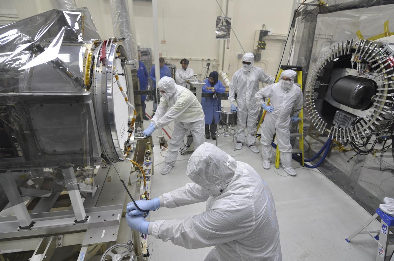 VANDENBERG AFB, Calif. – Engineers prepare to connect NASA's IRIS spacecraft to the nose of an Orbital Sciences Pegasus XL rocket that will lift the solar observatory into orbit in June. The work is taking place in a hangar at Vandenberg Air Force Base where IRIS, short for Interface Region Imaging Spectrograph, is being prepared for launch on a Pegasus XL rocket. Scheduled for launch from Vandenberg no earlier than June 26, 2013, IRIS will open a new window of discovery by tracing the flow of energy and plasma through the chromospheres and transition region into the sun’s corona using spectrometry and imaging. IRIS fills a crucial gap in our ability to advance studies of the sun-to-Earth connection by tracing the flow of energy and plasma through the foundation of the corona and the region around the sun known as the heliosphere. Photo credit: NASA/Randy Beaudoin
