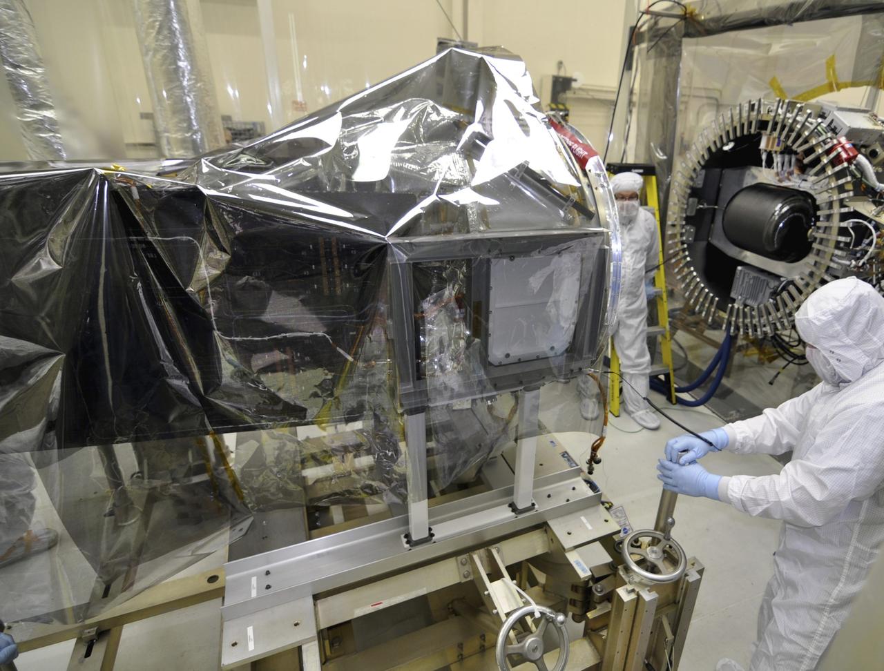 VANDENBERG AFB, Calif. – Engineers prepare to connect NASA's IRIS spacecraft to the nose of an Orbital Sciences Pegasus XL rocket that will lift the solar observatory into orbit in June. The work is taking place in a hangar at Vandenberg Air Force Base where IRIS, short for Interface Region Imaging Spectrograph, is being prepared for launch on a Pegasus XL rocket. Scheduled for launch from Vandenberg no earlier than June 26, 2013, IRIS will open a new window of discovery by tracing the flow of energy and plasma through the chromospheres and transition region into the sun’s corona using spectrometry and imaging. IRIS fills a crucial gap in our ability to advance studies of the sun-to-Earth connection by tracing the flow of energy and plasma through the foundation of the corona and the region around the sun known as the heliosphere. Photo credit: NASA/Randy Beaudoin