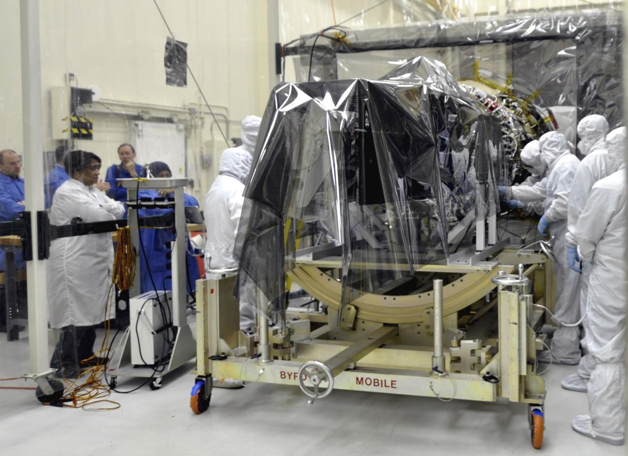 VANDENBERG AFB, Calif. – Engineers prepare to connect NASA's IRIS spacecraft to the nose of an Orbital Sciences Pegasus XL rocket that will lift the solar observatory into orbit in June. The work is taking place in a hangar at Vandenberg Air Force Base where IRIS, short for Interface Region Imaging Spectrograph, is being prepared for launch on a Pegasus XL rocket. Scheduled for launch from Vandenberg no earlier than June 26, 2013, IRIS will open a new window of discovery by tracing the flow of energy and plasma through the chromospheres and transition region into the sun’s corona using spectrometry and imaging. IRIS fills a crucial gap in our ability to advance studies of the sun-to-Earth connection by tracing the flow of energy and plasma through the foundation of the corona and the region around the sun known as the heliosphere. Photo credit: NASA/Randy Beaudoin