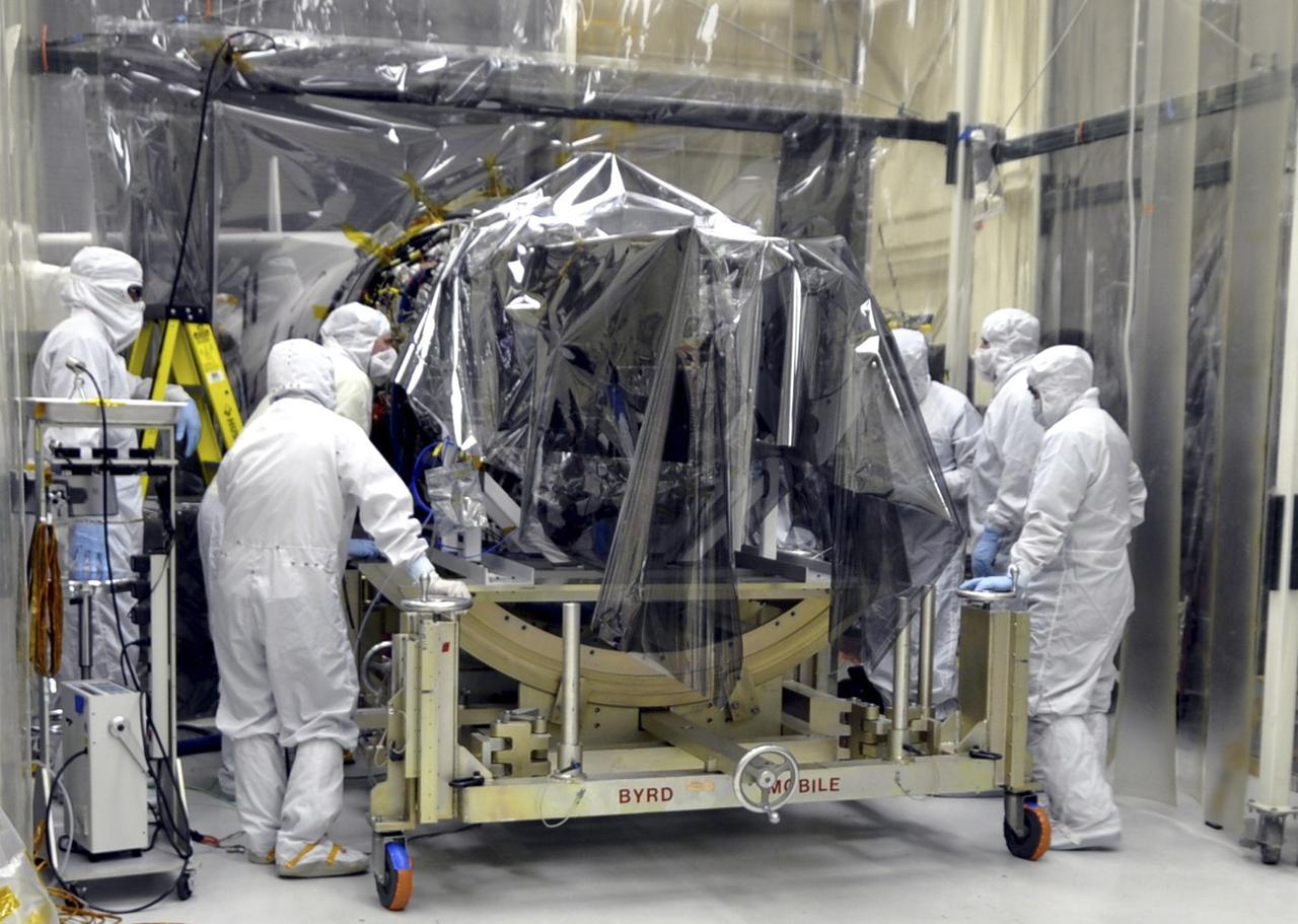 VANDENBERG AFB, Calif. – Engineers prepare to connect NASA's IRIS spacecraft to the nose of an Orbital Sciences Pegasus XL rocket that will lift the solar observatory into orbit in June. The work is taking place in a hangar at Vandenberg Air Force Base where IRIS, short for Interface Region Imaging Spectrograph, is being prepared for launch on a Pegasus XL rocket. Scheduled for launch from Vandenberg no earlier than June 26, 2013, IRIS will open a new window of discovery by tracing the flow of energy and plasma through the chromospheres and transition region into the sun’s corona using spectrometry and imaging. IRIS fills a crucial gap in our ability to advance studies of the sun-to-Earth connection by tracing the flow of energy and plasma through the foundation of the corona and the region around the sun known as the heliosphere. Photo credit: NASA/Randy Beaudoin