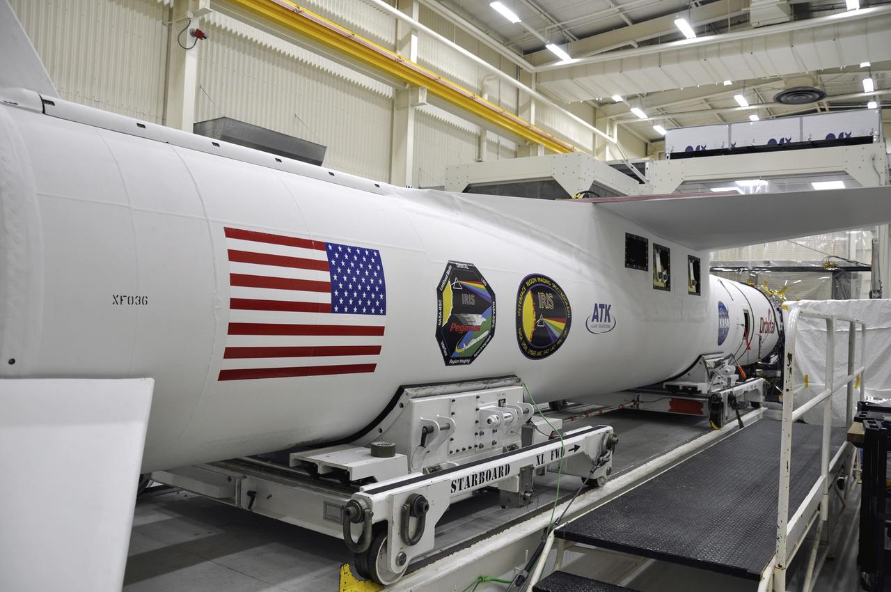 VANDENBERG AFB, Calif. - An Orbital Sciences Pegasus XL rocket undergoes launch preparations inside a hangar at Vandenberg Air Force Base for NASA's IRIS mission, short for Interface Region Imaging Spectrograph. Scheduled for launch from Vandenberg June 26, IRIS will open a new window of discovery by tracing the flow of energy and plasma through the chromospheres and transition region into the sun’s corona using spectrometry and imaging. IRIS fills a crucial gap in our ability to advance studies of the sun-to-Earth connection by tracing the flow of energy and plasma through the foundation of the corona and the region around the sun known as the heliosphere. Photo credit: NASA/Randy Beaudoin