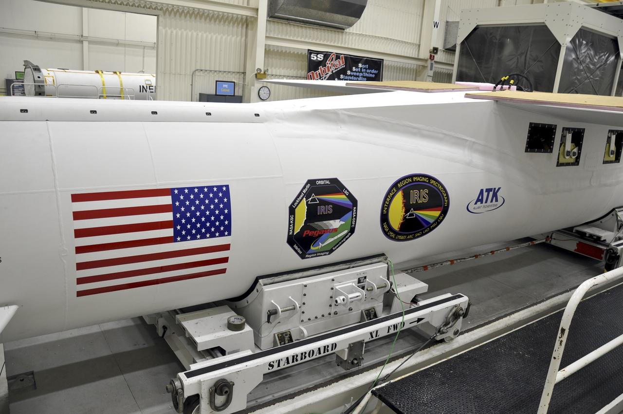 VANDENBERG AFB, Calif. - An Orbital Sciences Pegasus XL rocket undergoes launch preparations inside a hangar at Vandenberg Air Force Base for NASA's IRIS mission, short for Interface Region Imaging Spectrograph. Scheduled for launch from Vandenberg June 26, IRIS will open a new window of discovery by tracing the flow of energy and plasma through the chromospheres and transition region into the sun’s corona using spectrometry and imaging. IRIS fills a crucial gap in our ability to advance studies of the sun-to-Earth connection by tracing the flow of energy and plasma through the foundation of the corona and the region around the sun known as the heliosphere. Photo credit: NASA/Randy Beaudoin