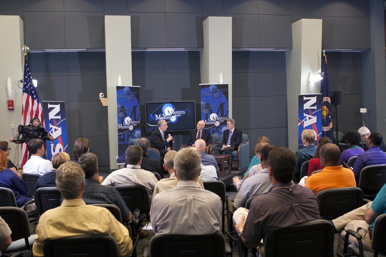 CAPE CANAVERAL, Fla. – Ed Hoffman, from left, Bob Sieck and Bob Cabana discuss techniques to handle a transition era during the second session in a weeklong series called "Masters with Masters" at the agency's Kennedy Space Center in Florida. Hoffman, NASA's chief Knowledge officer, Sieck, a former space shuttle launch director, and Cabana, the director of Kennedy, focused on the transition from Apollo to the shuttle and the current transition under way following the shuttle fleet's retirement. Photo credit: NASA/Jim Grossmann