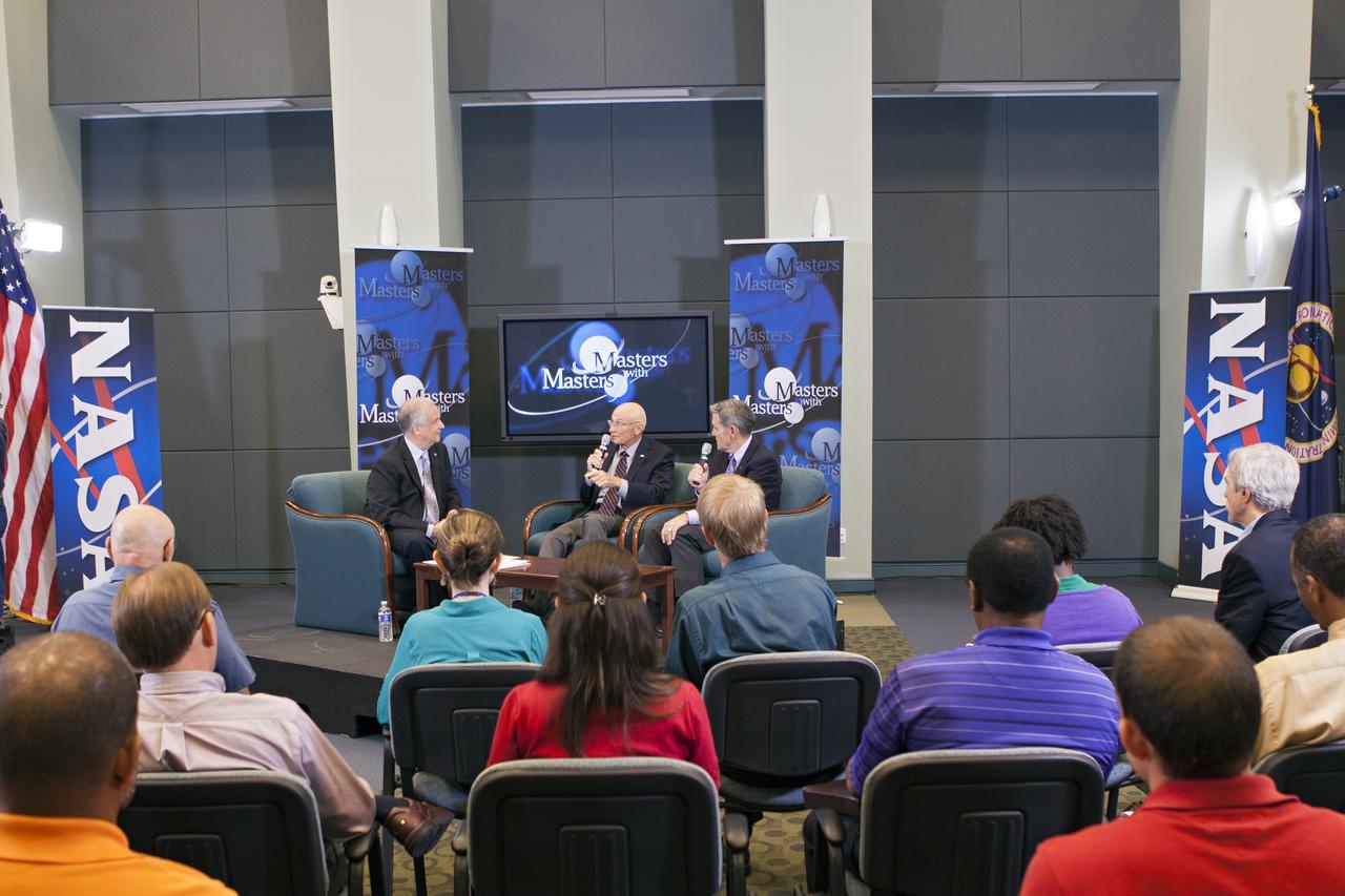 CAPE CANAVERAL, Fla. – Ed Hoffman, from left, Bob Sieck and Bob Cabana discuss techniques to handle a transition era during the second session in a weeklong series called "Masters with Masters" at the agency's Kennedy Space Center in Florida. Hoffman, NASA's chief Knowledge officer, Sieck, a former space shuttle launch director, and Cabana, the director of Kennedy, focused on the transition from Apollo to the shuttle and the current transition under way following the shuttle fleet's retirement. Photo credit: NASA/Jim Grossmann