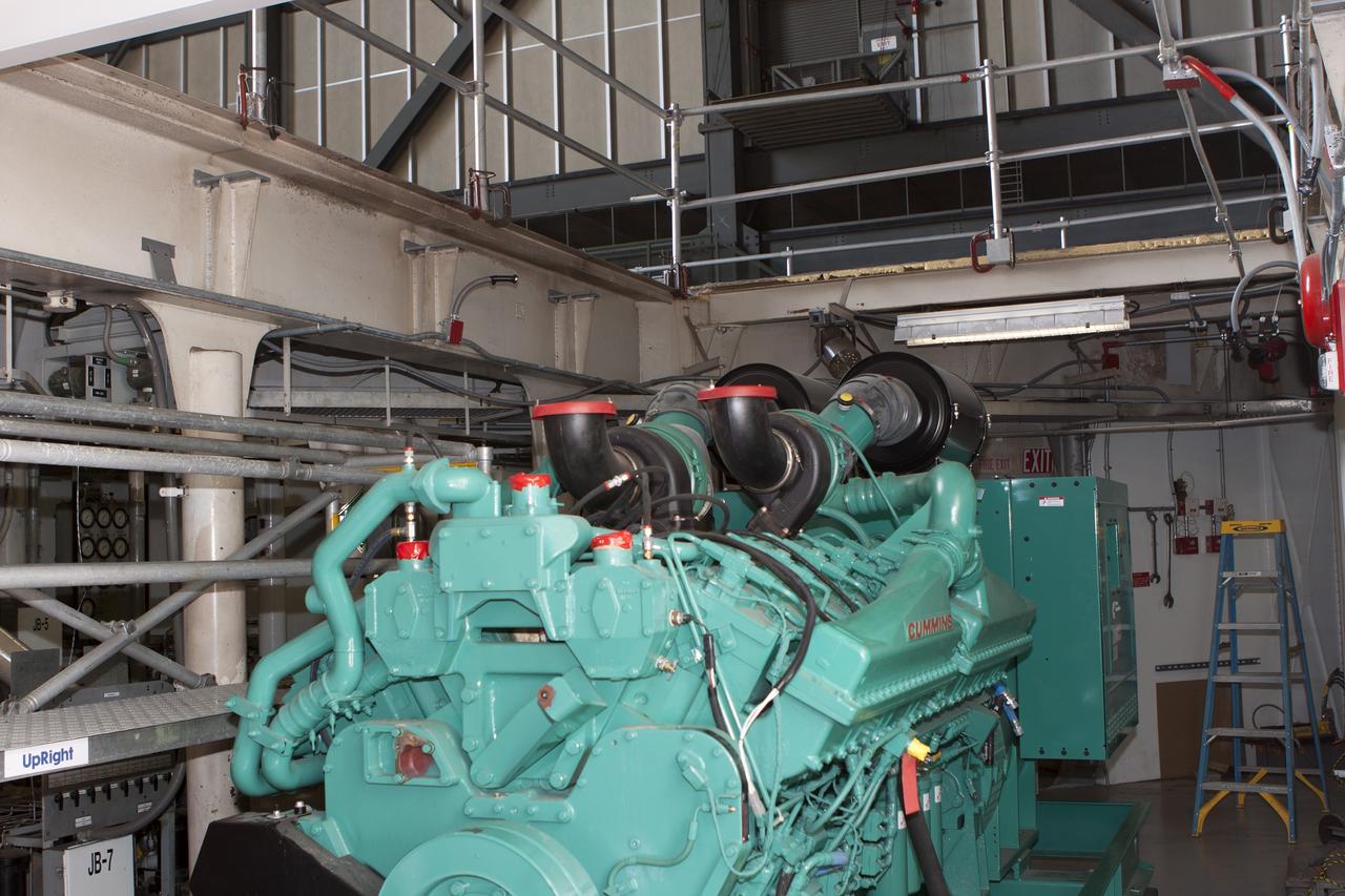 CAPE CANAVERAL, Fla. – Inside the Vehicle Assembly Building at NASA’s Kennedy Space Center in Florida, a new generator has been installed in crawler-transporter 1, or CT-1. Work continues in high bay 3 to upgrade CT-1 as part of its general maintenance. CT-1 could be available to carry commercial launch vehicles to the launch pad. The crawler-transporters were used to carry the mobile launcher platform and space shuttle to Launch Complex 39 for space shuttle launches for 30 years. Photo credit: NASA/Jim Grossmann