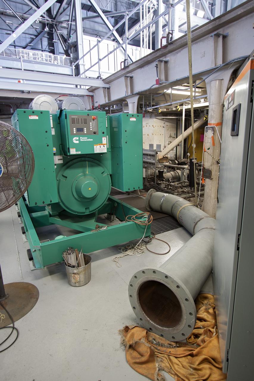 CAPE CANAVERAL, Fla. – Inside the Vehicle Assembly Building at NASA’s Kennedy Space Center in Florida, piping for a new exhaust system is being prepared for installation in crawler-transporter 1, or CT-1. Work continues in high bay 3 to upgrade CT-1 as part of its general maintenance. CT-1 could be available to carry commercial launch vehicles to the launch pad. The crawler-transporters were used to carry the mobile launcher platform and space shuttle to Launch Complex 39 for space shuttle launches for 30 years. Photo credit: NASA/Jim Grossmann