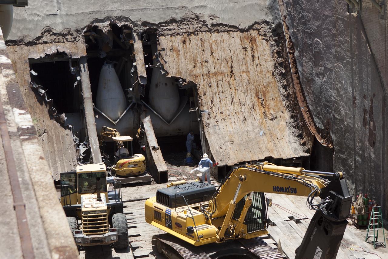 CAPE CANAVERAL, Fla. – At Launch Pad 39B at NASA’s Kennedy Space Center in Florida, workers are removing the flame trench deflector that sits below and between the left and right crawler track panels.    Launch Pad 39B is being refurbished to support NASA’s Space Launch System and other launch vehicles. The Ground Systems Development and Operations, or GSDO, Program office at Kennedy is leading the center’s transformation to safely handle a variety of rockets and spacecraft. For more information about GSDO, visit: http://go.nasa.gov/groundsystems. Photo credit: NASA/Jim Grossman