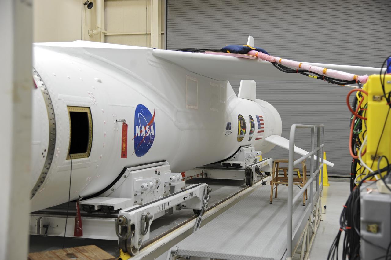 VANDENBERG AFB – Detail of the Orbital Sciences Pegasus XL rocket that will lift NASA's IRIS solar observatory into orbit in June. The work is taking place in a hangar at Vandenberg Air Force Base where IRIS, short for Interface Region Imaging Spectrograph, is being prepared for launch from Vandenberg June 26. IRIS will open a new window of discovery by tracing the flow of energy and plasma through the chromospheres and transition region into the sun’s corona using spectrometry and imaging. IRIS fills a crucial gap in our ability to advance studies of the sun-to-Earth connection by tracing the flow of energy and plasma through the foundation of the corona and the region around the sun known as the heliosphere. Photo credit: NASA/Tony Vauclin