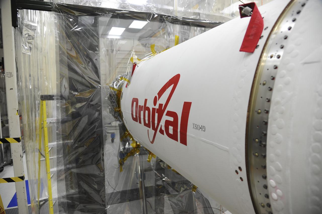 VANDENBERG AFB – Detail of the Orbital Sciences Pegasus XL rocket that will lift NASA's IRIS solar observatory into orbit in June. The work is taking place in a hangar at Vandenberg Air Force Base where IRIS, short for Interface Region Imaging Spectrograph, is being prepared for launch from Vandenberg June 26. IRIS will open a new window of discovery by tracing the flow of energy and plasma through the chromospheres and transition region into the sun’s corona using spectrometry and imaging. IRIS fills a crucial gap in our ability to advance studies of the sun-to-Earth connection by tracing the flow of energy and plasma through the foundation of the corona and the region around the sun known as the heliosphere. Photo credit: NASA/Tony Vauclin