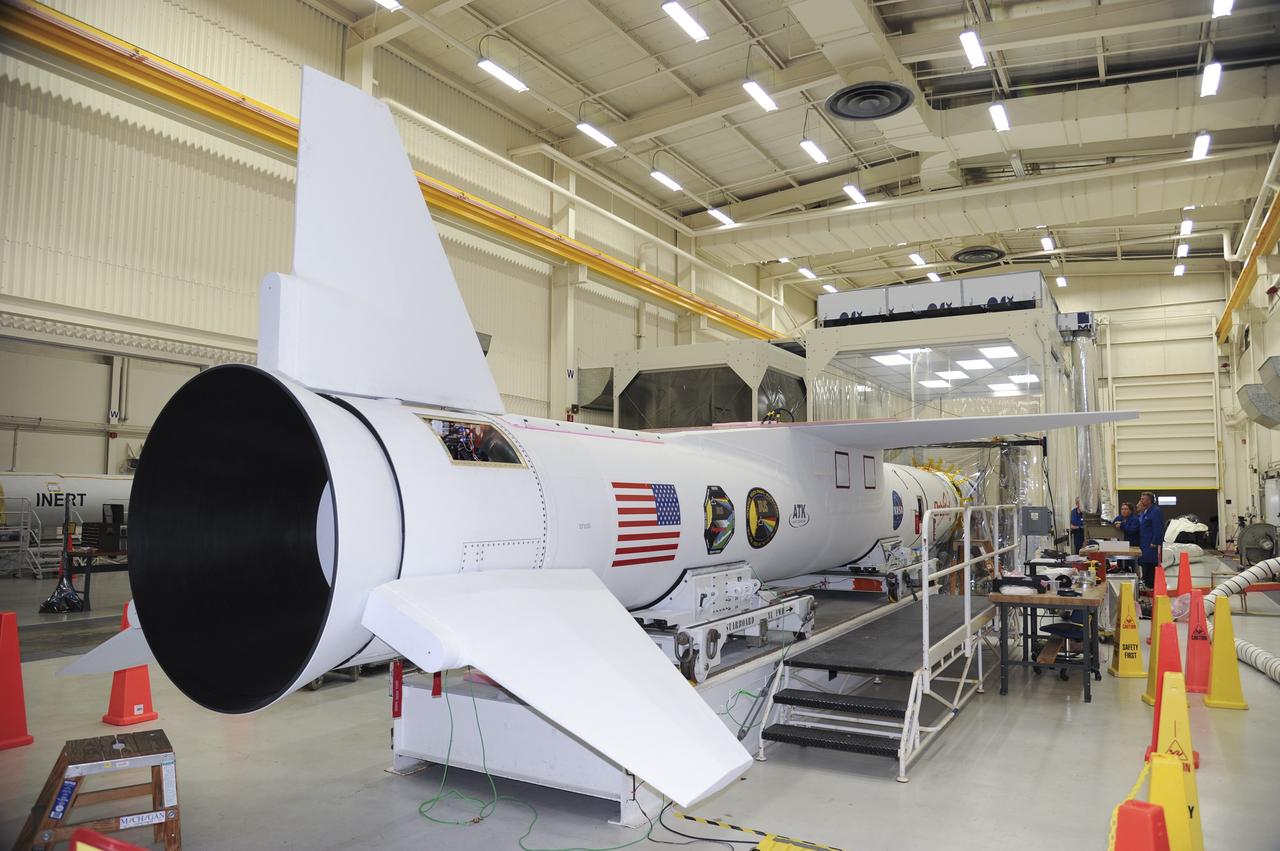 VANDENBERG AFB – The Orbital Sciences Pegasus XL rocket that will lift the solar observatory into orbit in June is seen after the payload fairing was connected over NASA's IRIS spacecraft. The work is taking place in a hangar at Vandenberg Air Force Base where IRIS, short for Interface Region Imaging Spectrograph, is being prepared for launch on a Pegasus XL rocket. Scheduled for launch from Vandenberg June 26, IRIS will open a new window of discovery by tracing the flow of energy and plasma through the chromospheres and transition region into the sun’s corona using spectrometry and imaging. IRIS fills a crucial gap in our ability to advance studies of the sun-to-Earth connection by tracing the flow of energy and plasma through the foundation of the corona and the region around the sun known as the heliosphere. Photo credit: NASA/Tony Vauclin