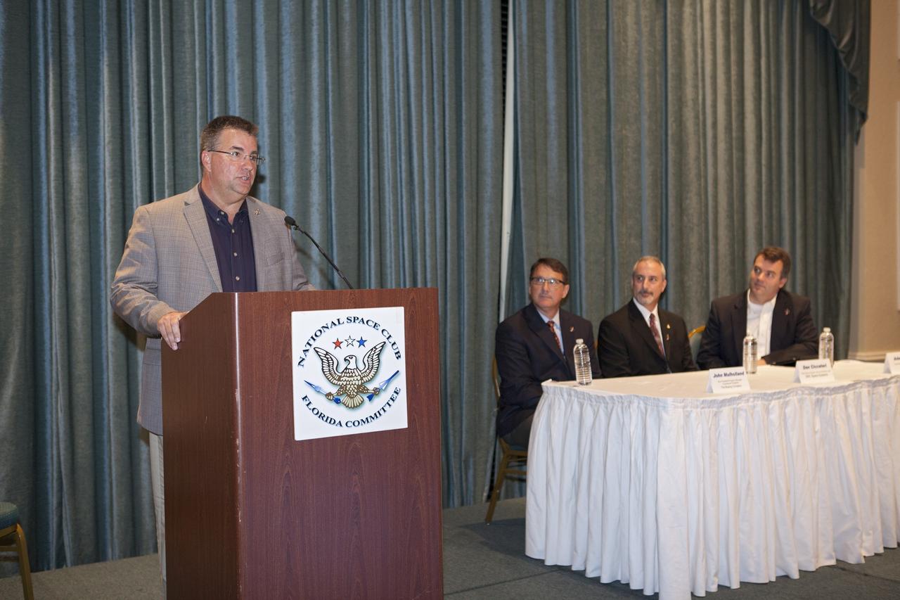 CAPE CANAVERAL, Fla. - Ed Mango, manager of NASA's Commercial Crew Program, or CCP, speaks to a crowd of spaceflight enthusiasts at the National Space Club Florida Committee's June meeting near the Kennedy Space Center. Mango was joined at the Radisson Resort at the Port in Cape Canaveral, Fla., by partner representatives from The Boeing Company, Sierra Nevada Corporation, or SNC, and Space Exploration Technologies, or SpaceX, all of whom plan to increase their commercial activities on Florida’s space coast to send astronauts to low-Earth orbit. Seated from left are vice president and program manager of Boeing's Commercial Programs John Mulholland, SNC's chief systems engineer Dan Ciccateri, and SpaceX's vice president of government sales Adam Harris.        To learn more about the Commercial Crew Program, visit www.nasa.gov/commercialcrew. Photo credit: Kim Shiflett