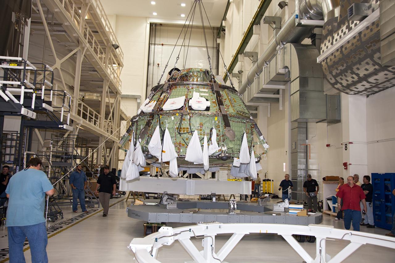 CAPE CANAVERAL, Fla. – Inside the Operations and Checkout Building high bay at NASA’s Kennedy Space Center in Florida, a crane has lifted the Orion crew module out of a special test stand and is lowering the module onto another test stand. Lockheed Martin Space Systems and NASA engineers performed a series of static load tests on Orion that simulated the massive loads the spacecraft would experience during its mission. Orion is the exploration spacecraft designed to carry crews to space beyond low Earth orbit. It will provide emergency abort capability, sustain the crew during the space travel and provide safe re-entry from deep space return velocities. Orion’s first unpiloted test flight, Exploration Flight Test 1, is scheduled to launch in 2014 atop a Delta IV rocket. A second uncrewed flight test is scheduled for 2017 on NASA’s Space Launch System rocket. For more information, visit http://www.nasa.gov/orion. Photo credit: NASA/Daniel Casper