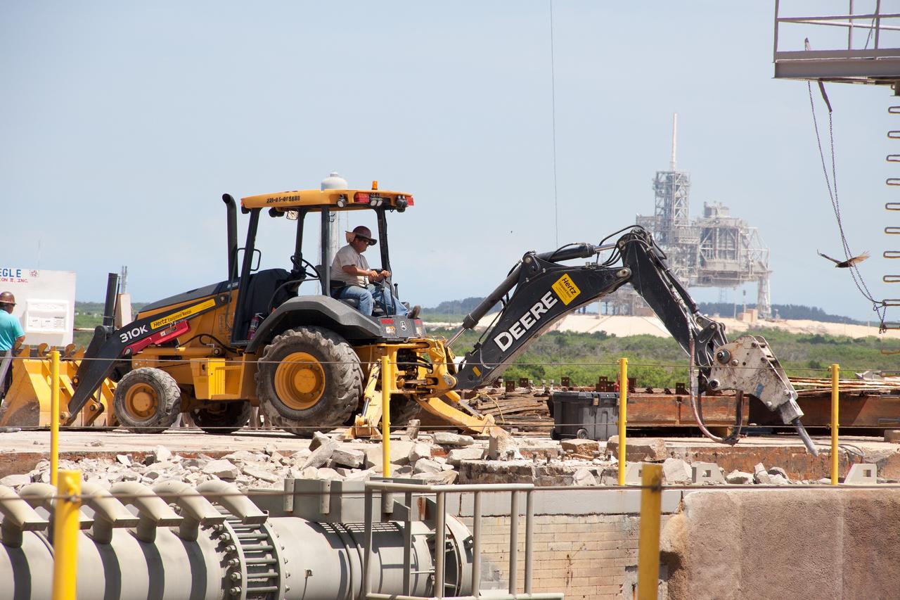 CAPE CANAVERAL, Fla. – At Launch Pad 39B at NASA’s Kennedy Space Center in Florida, crawler track panels have been removed from the surface and construction workers are repairing the concrete surface and catacomb roof below.     Launch Pad 39B is being refurbished to support NASA’s Space Launch System and other launch vehicles. The Ground Systems Development and Operations, or GSDO, Program office at Kennedy is leading the center’s transformation to safely handle a variety of rockets and spacecraft. For more information about GSDO, visit: http://go.nasa.gov/groundsystems. Photo credit: NASA/Jim Grossman