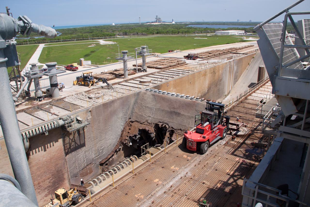 CAPE CANAVERAL, Fla. – At Launch Pad 39B at NASA’s Kennedy Space Center in Florida, crawler track panels have been removed from the surface and construction workers are repairing the concrete surface and catacomb roof below.     Launch Pad 39B is being refurbished to support NASA’s Space Launch System and other launch vehicles. The Ground Systems Development and Operations, or GSDO, Program office at Kennedy is leading the center’s transformation to safely handle a variety of rockets and spacecraft. For more information about GSDO, visit: http://go.nasa.gov/groundsystems. Photo credit: NASA/Jim Grossman