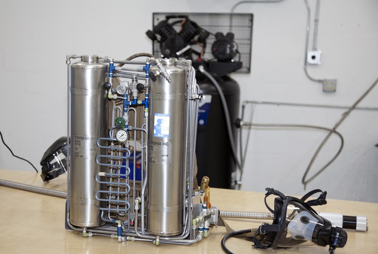 TITUSVILLE, Fla. - A small liquid-air filled backpack called CryoBA, short for Cryogenic Breathing Apparatus, is on display at BCS Life Support in Titusville, Fla. The CryoBA and a larger Cryogenic Refuge Alternative Supply System, or CryoRASS, are being developed by a NASA Kennedy Space Center engineering team in collaboration with The National Institute for Occupational Safety and Health to provide miners with twice the amount of breathable and cooler air than traditional compressed systems. The technology also could be used for commercial applications, such as fire and military rescue operations, as well as NASA's future human spaceflight missions. Photo credit: NASA/Daniel Casper
