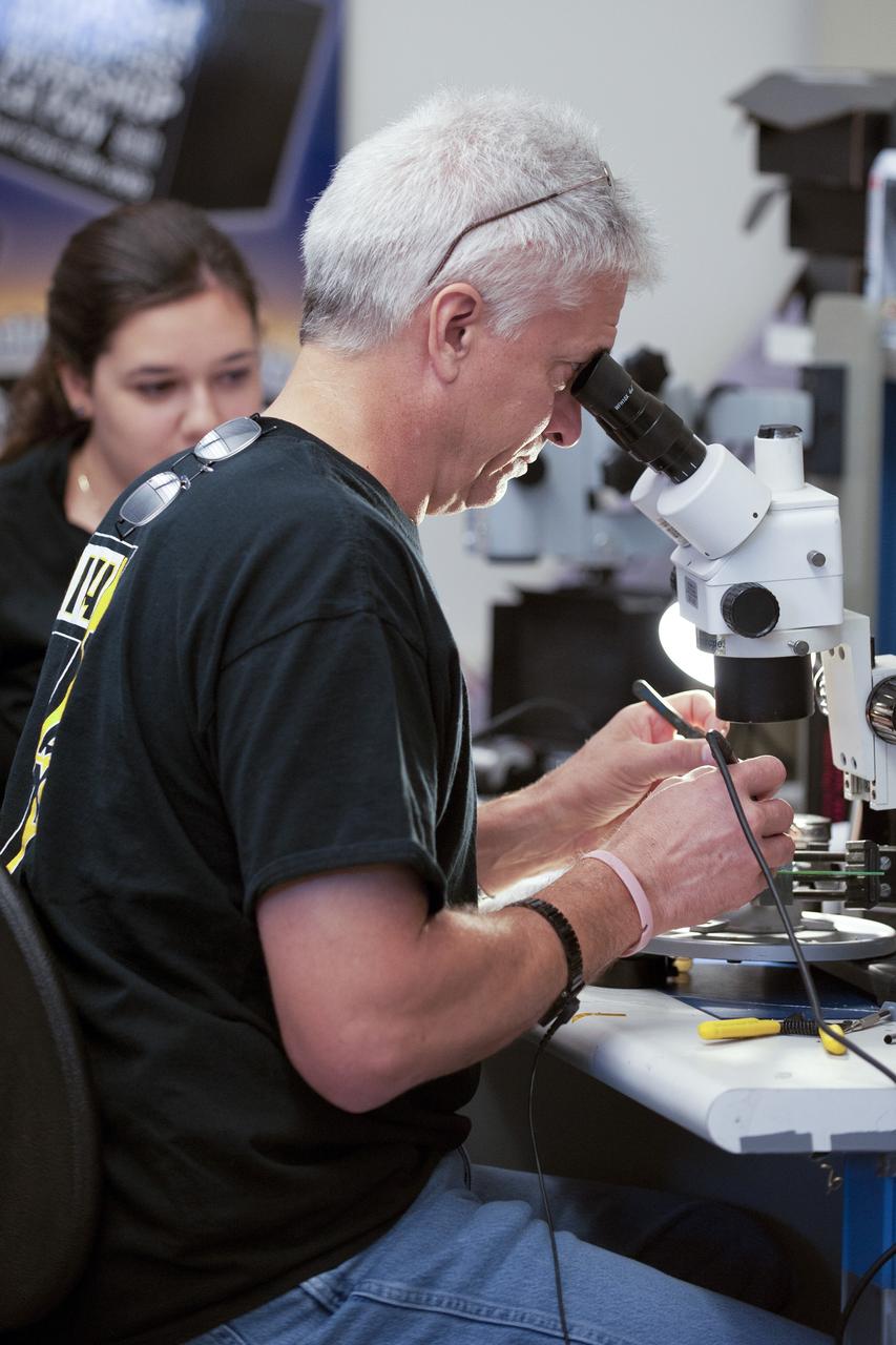 SAN LUIS OBISPO, Calif. – Jim Kinney, a NASA mentor for the student launch team of the StangSat, works inside the CubeSat lab facility at California Polytechnic Institute, or CalPoly. The payload, which includes sensors and equipment carefully packaged into 4-inch cubes, will ride in the body of a Garvey Spacecraft Corporation's Prospector P-18D rocket during a June 15 launch on a high-altitude, suborbital flight. Known as a CubeSat, the StangSat will record shock, vibrations and heat inside the rocket. It will not be released during the test flight, but the results will be used to prove or strengthen the design before it is carried into orbit in 2014 on a much larger rocket. A new, lightweight carrier is also being tested for use on future missions to deploy the small spacecraft. The flight also is being watched closely as a model for trying out new or off-the-shelf technologies quickly before putting them in the pipeline for use on NASA's largest launchers. Built by several different organizations, including a university, a NASA field center and a high school, the spacecraft are four-inch cubes designed to fly on their own eventually, but will remain firmly attached to the rocket during the upcoming mission. For more information, visit http://www.nasa.gov/mission_pages/smallsats/elana/cubesatlaunchpreview.html Photo credit: VAFB/Kathi Peoples