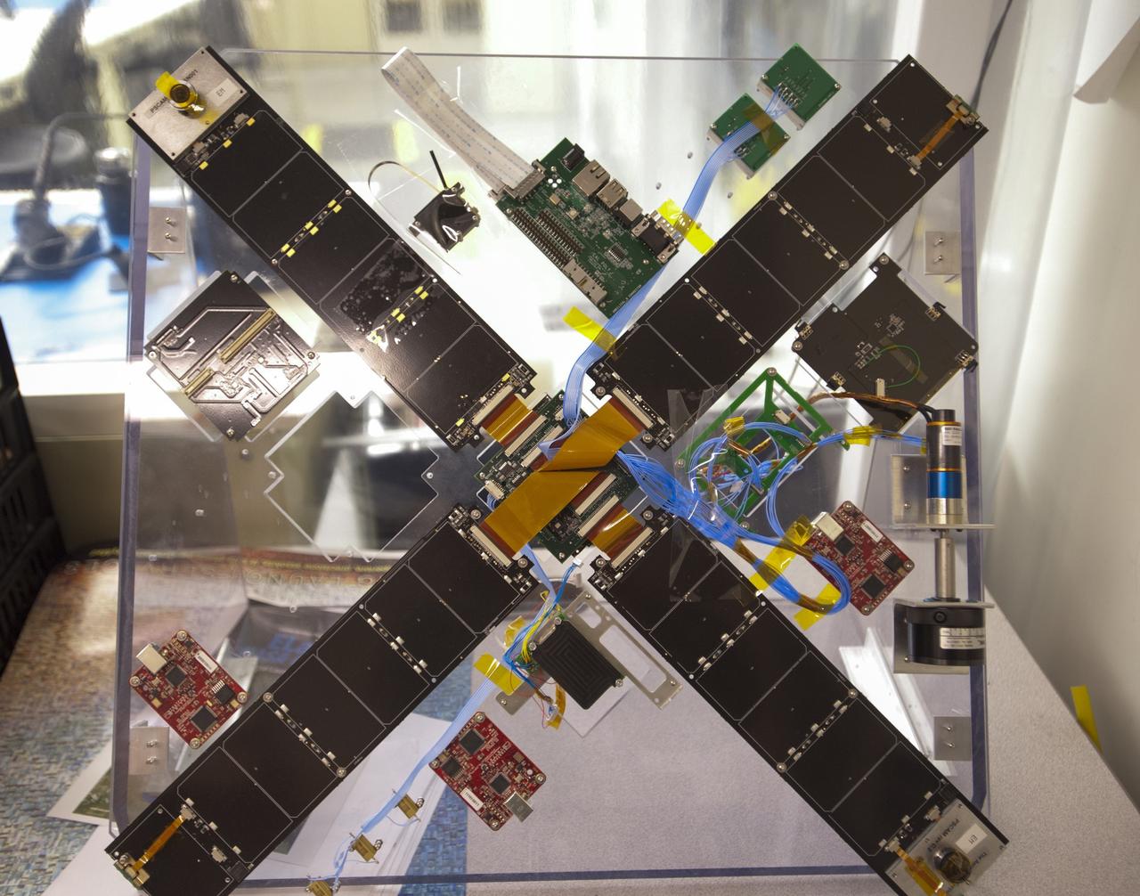 SAN LUIS OBISPO, Calif. – Some of the componentry for the Polysat in the CubeSat lab facility at California Polytechnic Institute, or CalPoly. The payload, which includes sensors and equipment carefully packaged into 4-inch cube sections, will ride in the body of a Garvey Spacecraft Corporation's Prospector P-18D rocket during a June 15 launch on a high-altitude, suborbital flight. Known as a CubeSat, the satellite will record shock, vibrations and heat inside the rocket. It will not be released during the test flight, but the results will be used to prove or strengthen their designs before they are carried into orbit in 2014 on a much larger rocket. A new, lightweight carrier is also being tested for use on future missions to deploy the small spacecraft. The flight also is being watched closely as a model for trying out new or off-the-shelf technologies quickly before putting them in the pipeline for use on NASA's largest launchers. Built by several different organizations, including a university, a NASA field center and a high school, the spacecraft are four-inch cubes designed to fly on their own eventually, but will remain firmly attached to the rocket during the upcoming mission. For more information, visit http://www.nasa.gov/mission_pages/smallsats/elana/cubesatlaunchpreview.html Photo credit: VAFB/Kathi Peoples