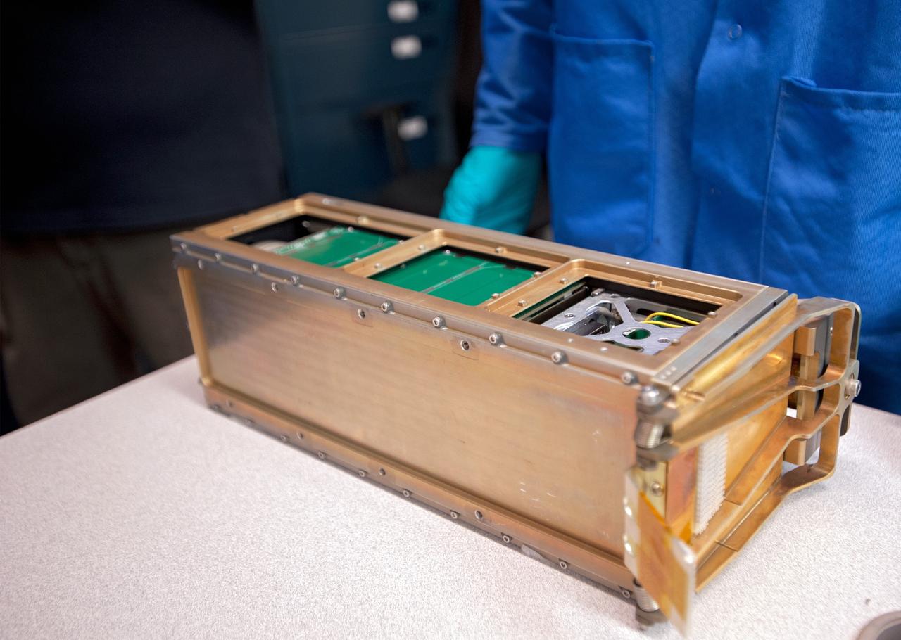 SAN LUIS OBISPO, Calif. – A Poly Picosatellite Orbital Dispensor, or P-Pod nanolauncher/carrier in the CubeSat lab facility at California Polytechnic Institute, or CalPoly. The payload, which includes sensors and equipment carefully packaged into 4-inch cube sections, will ride in the body of a Garvey Spacecraft Corporation's Prospector P-18D rocket during a June 15 launch on a high-altitude, suborbital flight. Known as a CubeSat, the satellite will record shock, vibrations and heat inside the rocket. It will not be released during the test flight, but the results will be used to prove or strengthen their designs before they are carried into orbit in 2014 on a much larger rocket. The flight also is being watched closely as a model for trying out new or off-the-shelf technologies quickly before putting them in the pipeline for use on NASA's largest launchers. Built by several different organizations, including a university, a NASA field center and a high school, the spacecraft are four-inch cubes designed to fly on their own eventually, but will remain firmly attached to the rocket during the upcoming mission. For more information, visit http://www.nasa.gov/mission_pages/smallsats/elana/cubesatlaunchpreview.html Photo credit: VAFB/Kathi Peoples