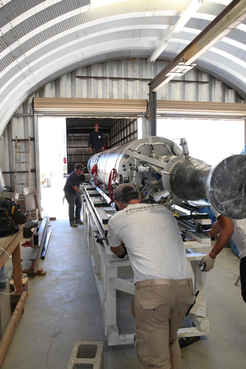MOJAVE DESERT, Calif. – In the Mojave Desert in California, students and engineers load the Garvey Spacecraft Corporation's Prospector P-18D rocket onto a truck for transportation to the launch site. The rocket is scheduled for launch June 15 with the RUBICS-1 payload on a high-altitude, suborbital flight. The rocket will carry four satellites made from four-inch cube sections. Collectively known as CubeSats, the satellites will record shock, vibrations and heat inside the rocket. They will not be released during the test flight, but the results will be used to prove or strengthen their designs before they are carried into orbit in 2014 on a much larger rocket. A new, lightweight carrier is also being tested for use on future missions to deploy the small spacecraft. The flight also is being watched closely as a model for trying out new or off-the-shelf technologies quickly before putting them in the pipeline for use on NASA's largest launchers. Built by several different organizations, including a university, a NASA field center and a high school, the spacecraft are four-inch cubes designed to fly on their own eventually, but will remain firmly attached to the rocket during the upcoming mission. For more information, visit http://www.nasa.gov/mission_pages/smallsats/elana/cubesatlaunchpreview.html Photo credit: NASA/Dimitri Gerondidakis