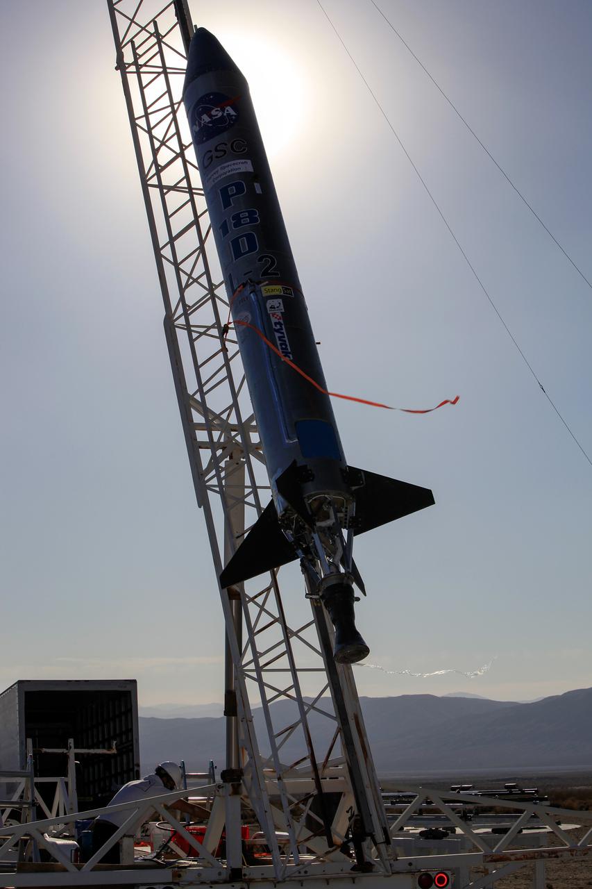 MOJAVE DESERT, Calif. – In the Mojave Desert in California, the Garvey Spacecraft Corporation's Prospector P-18D rocket is lifted into position for its scheduled launch on June 15 with the RUBICS-1 payload on a high-altitude, suborbital flight. The rocket will carry four satellites made from four-inch cube sections. Collectively known as CubeSats, the satellites will record shock, vibrations and heat inside the rocket. They will not be released during the test flight, but the results will be used to prove or strengthen their designs before they are carried into orbit in 2014 on a much larger rocket. A new, lightweight carrier is also being tested for use on future missions to deploy the small spacecraft. The flight also is being watched closely as a model for trying out new or off-the-shelf technologies quickly before putting them in the pipeline for use on NASA's largest launchers. Built by several different organizations, including a university, a NASA field center and a high school, the spacecraft are four-inch cubes designed to fly on their own eventually, but will remain firmly attached to the rocket during the upcoming mission. For more information, visit http://www.nasa.gov/mission_pages/smallsats/elana/cubesatlaunchpreview.html Photo credit: NASA/Dimitri Gerondidakis