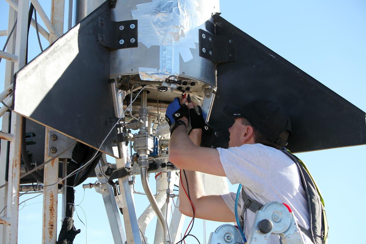 MOJAVE DESERT, Calif. – In the Mojave Desert in California, final checkouts are completed on the Garvey Spacecraft Corporation's Prospector P-18D rocket positioned for launch with the RUBICS-1 payload on a high-altitude, suborbital flight. The rocket will carry four satellites made from four-inch cube sections. The rocket reached a peak altitude of about 9,000 feet, however the parachute deployed prematurely and the vehicle continued on its trajectory, coasting and tumbling to a hard landing on its side. In spite of the rough ride, all four CubeSats were recovered. PhoneSat and RUBICS received data in flight, but sustained structural damage. CP-9 and StangSat fared better, and their teams are working to recover as much information as possible. Collectively known as CubeSats, the satellites were designed to record shock, vibrations and heat inside the rocket. The results will be used to prove or strengthen their designs before they are carried into orbit in 2014 on a much larger rocket. Built by several different organizations, including a university, a NASA field center and a high school, the spacecraft are four-inch cubes designed to fly on their own eventually, but will remain firmly attached to the rocket during the upcoming mission. For more information, visit http://www.nasa.gov/mission_pages/smallsats/elana/cubesatlaunchpreview.html Photo credit: NASA/Dimitri Gerondidakis