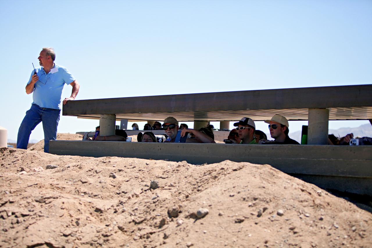 MOJAVE DESERT, Calif. – In the Mojave Desert in California, Kevin Baxter, a range representative of the Friends of Amateur Rocketry launch site, ensures all is ready for launch of the Garvey Spacecraft Corporation's Prospector P-18D rocket with the RUBICS-1 payload on a high-altitude, suborbital flight. The rocket will carry four satellites made from four-inch cube sections.      The rocket reached a peak altitude of about 9,000 feet, however the parachute deployed prematurely and the vehicle continued on its trajectory, coasting and tumbling to a hard landing on its side. In spite of the rough ride, all four CubeSats were recovered. PhoneSat and RUBICS received data in flight, but sustained structural damage. CP-9 and StangSat fared better, and their teams are working to recover as much information as possible. Collectively known as CubeSats, the satellites were designed to record shock, vibrations and heat inside the rocket. The results will be used to prove or strengthen their designs before they are carried into orbit in 2014 on a much larger rocket. Built by several different organizations, including a university, a NASA field center and a high school, the spacecraft are four-inch cubes designed to fly on their own eventually, but will remain firmly attached to the rocket during the upcoming mission. For more information, visit http://www.nasa.gov/mission_pages/smallsats/elana/cubesatlaunchpreview.html Photo credit: NASA/Dimitri Gerondidakis